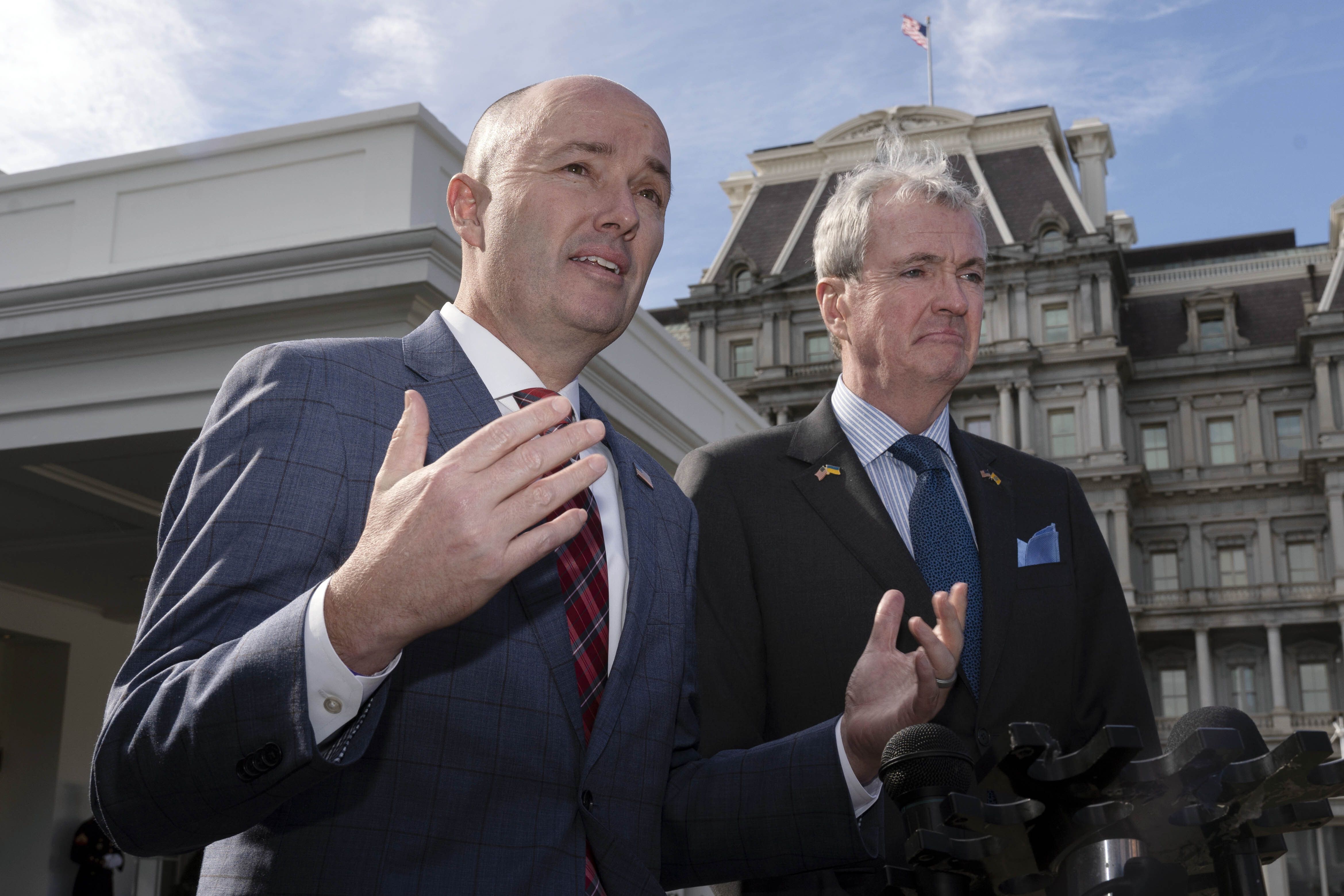 National Governors Association Vice Chair Gov. Spencer Cox, of Utah, and Chair Gov. Phil Murphy of New Jersey, right, speak to reporters outside the West Wing of the White House in Washington, following a meeting with President Joe Biden and Vice President Kamala Harris, Friday