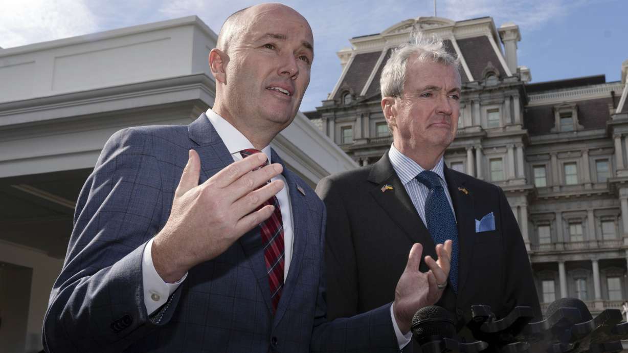 National Governors Association Vice Chair Gov. Spencer Cox, of Utah, and Chair Gov. Phil Murphy of New Jersey, right, speak to reporters outside the West Wing of the White House in Washington, following a meeting with President Joe Biden and Vice President Kamala Harris, Friday