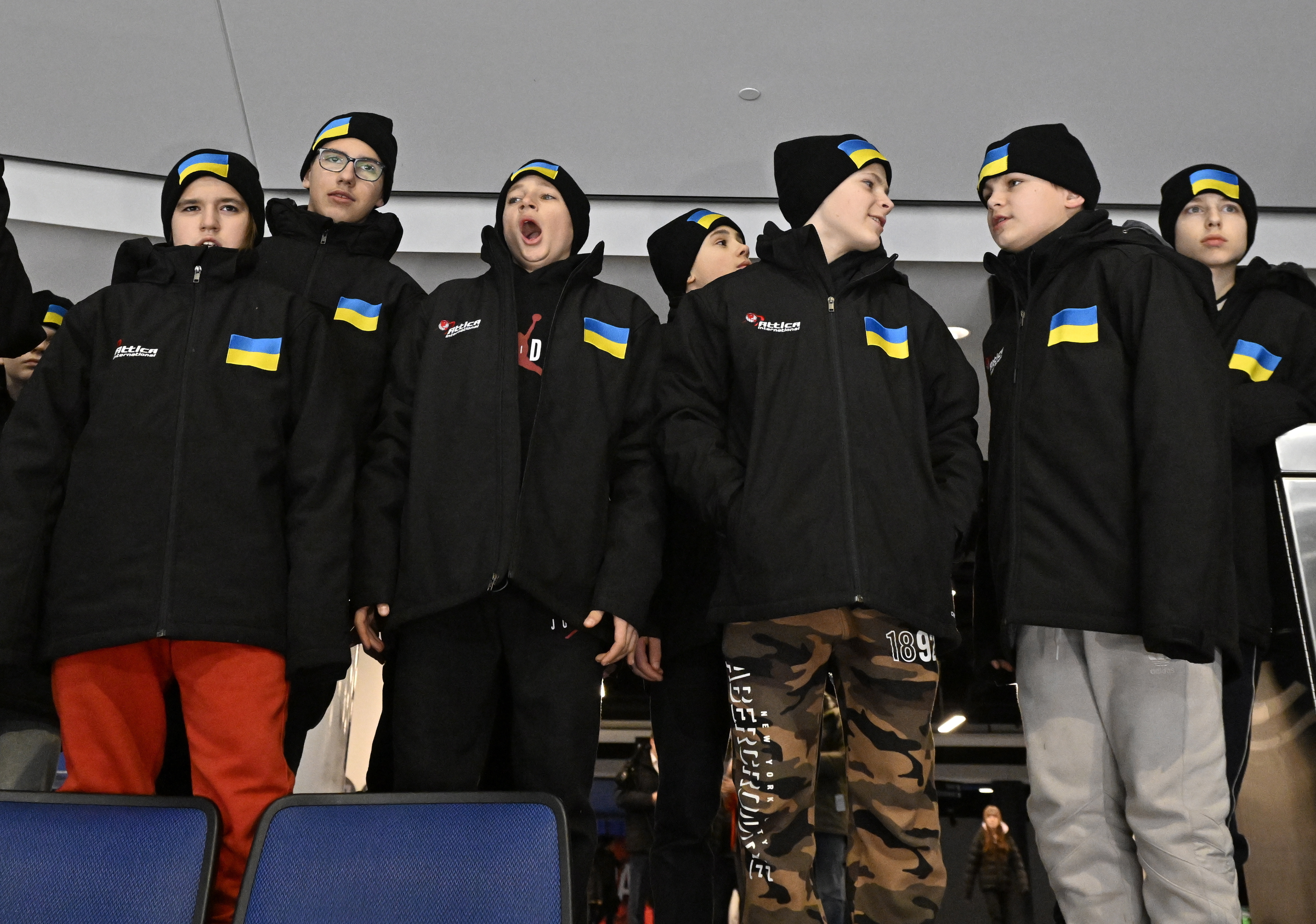 FILE - Ukrainian peewee hockey players check out the arena as they arrive, Wednesday, Feb. 1, 2023 at the Videotron Centre in Quebec City. The Ukraine team will compete at the Quebec international peewee hockey tournament. 