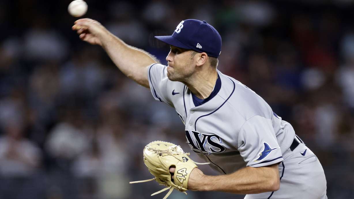 FILE - Tampa Bay Rays pitcher Jason Adam throws during the ninth inning of the team's baseball game against the New York Yankees on Monday, Aug. 15, 2022, in New York. Adam became the fourth Tampa Bay player to go to a salary arbitration hearing this year, asking a panel for $1,775,000 on Friday, Feb. 10, 2023, while the Rays argued for $1.55 million.