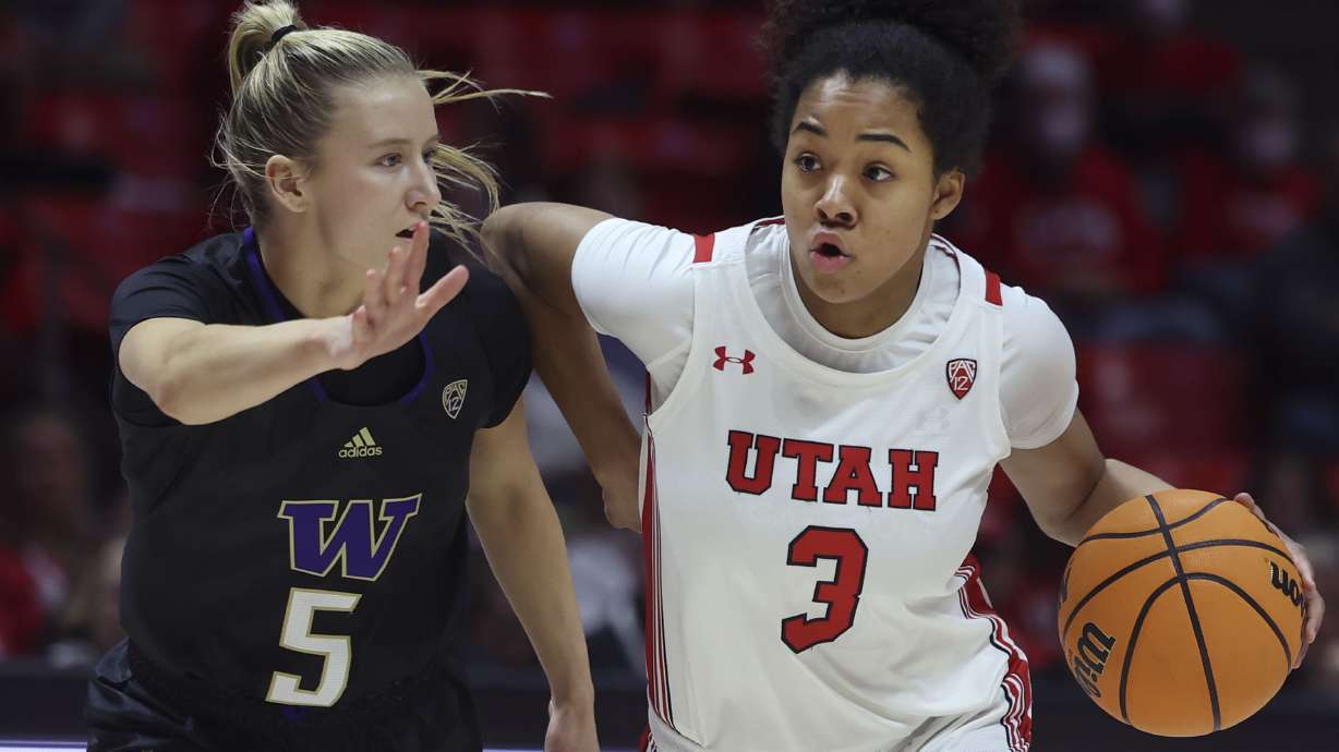 Washington Huskies guard Teagan Brown (5) tries to stop Utah Utes guard Lani White (3) at the Jon M. Huntsman Center in Salt Lake City on Friday, Feb. 10, 2023.
