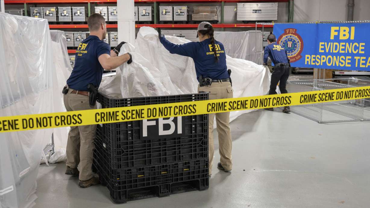 FBI special agents assigned to the evidence response team process material recovered from the high-altitude balloon recovered off the coast of S.C. Thursday, at the FBI laboratory in Quantico, Va. The United States on Friday blacklisted six Chinese entities it said were linked to Beijing's aerospace programs as part of its retaliation over an alleged Chinese spy balloon that traversed the country's airspace.