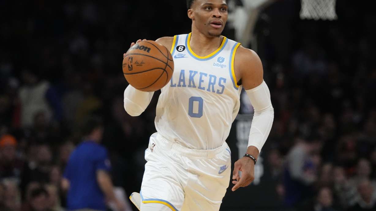 FILE - Los Angeles Lakers' Russell Westbrook brings the ball up during the second half of the team's NBA basketball game against the New York Knicks on Jan. 31, 2023, in New York. The Lakers traded Westbrook to the Utah Jazz and reacquired guard D'Angelo Russell from Minnesota in a three-team, eight-player deal Wednesday night, Feb. 8, ahead of the NBA's trade deadline, a person with knowledge of the trade told The Associated Press.