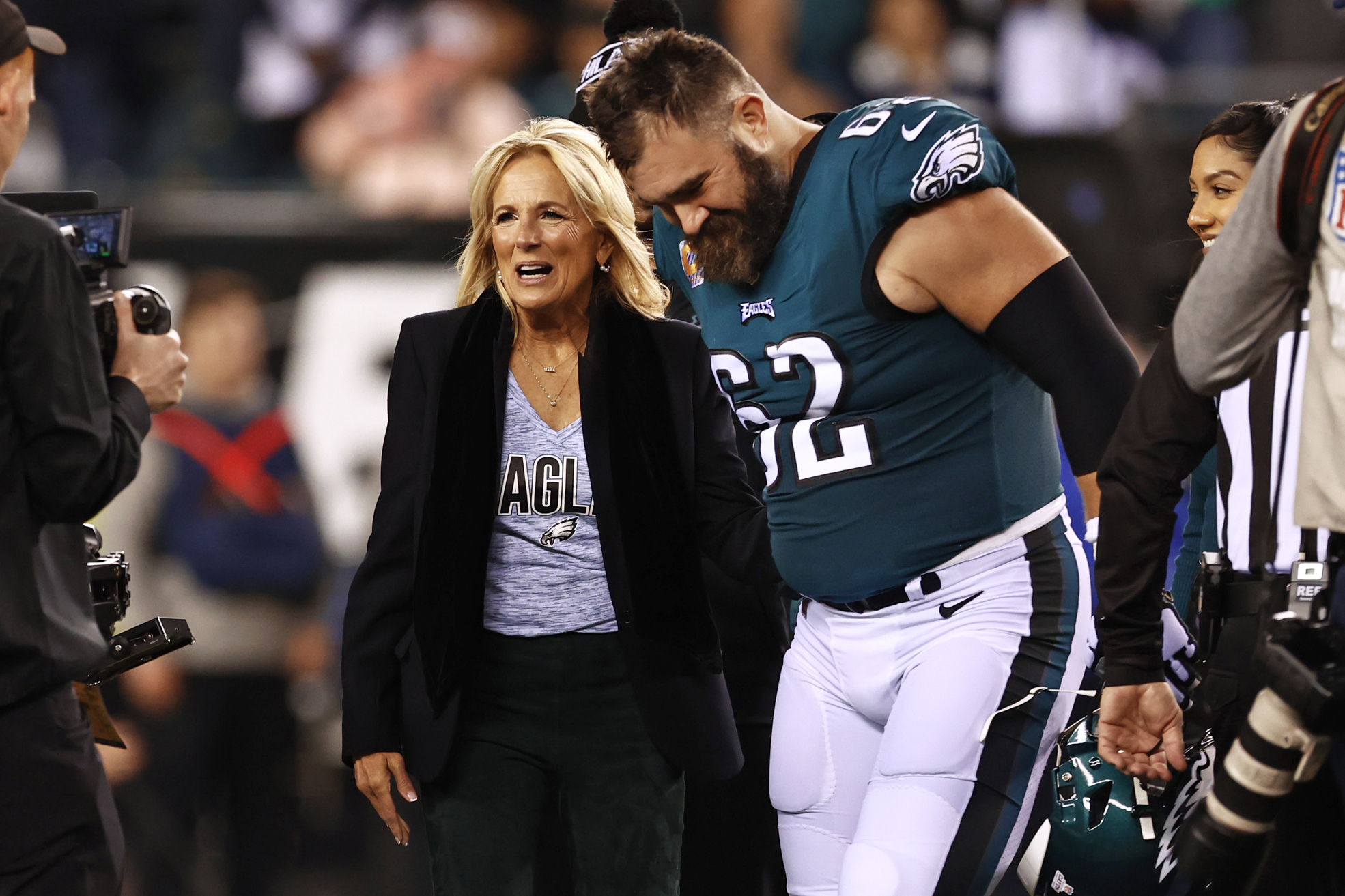 FILE - First lady Jill Biden talks with Philadelphia Eagles center Jason Kelce (62) before the coin toss before an NFL football game against the Dallas Cowboys, Oct. 16, 2022, in Philadelphia.