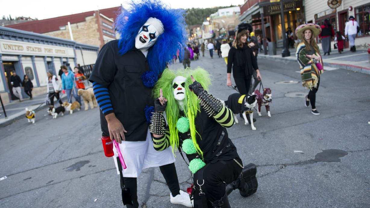 Garth Vaz, left, and Doni Medici pose for a photo in Park City on Oct. 31, 2016. Lawmakers are considering when Utahns should celebrate Halloween.