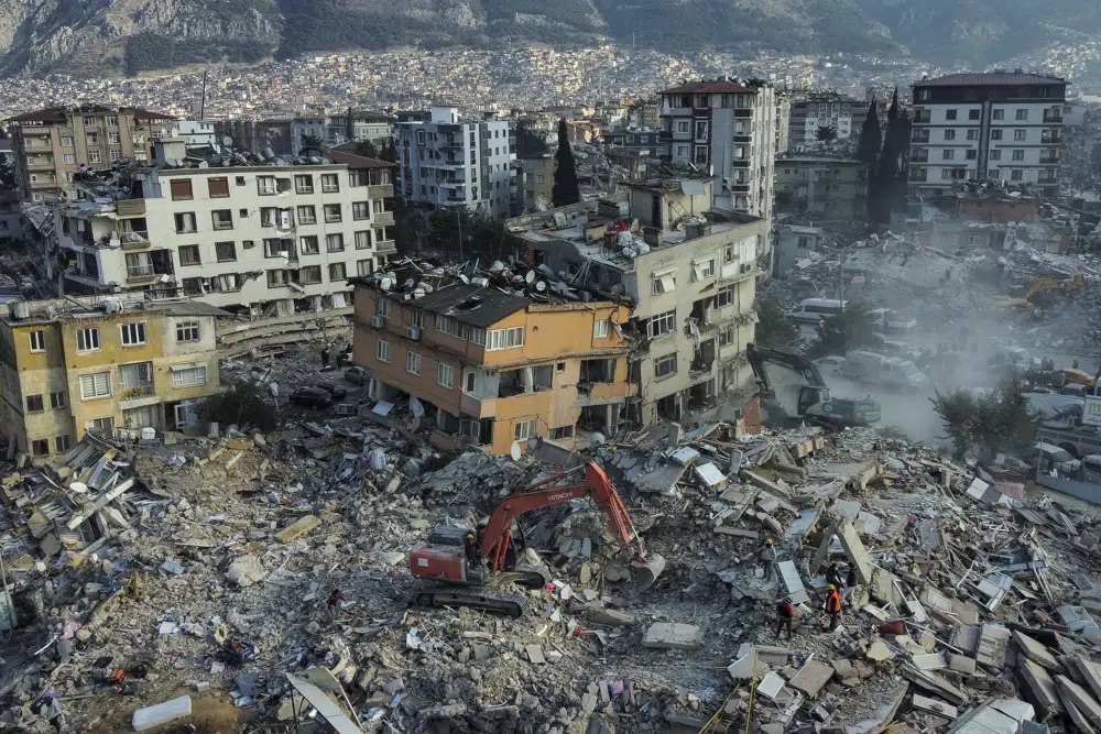 An aerial view of collapsed buildings in Antakya, southeastern Turkey, Saturday. Rescue teams using thermal cameras to locate signs of life are continuing to pull survivors out of mounds of rubble, five days after a major earthquake struck a sprawling border region of Turkey and Syria.