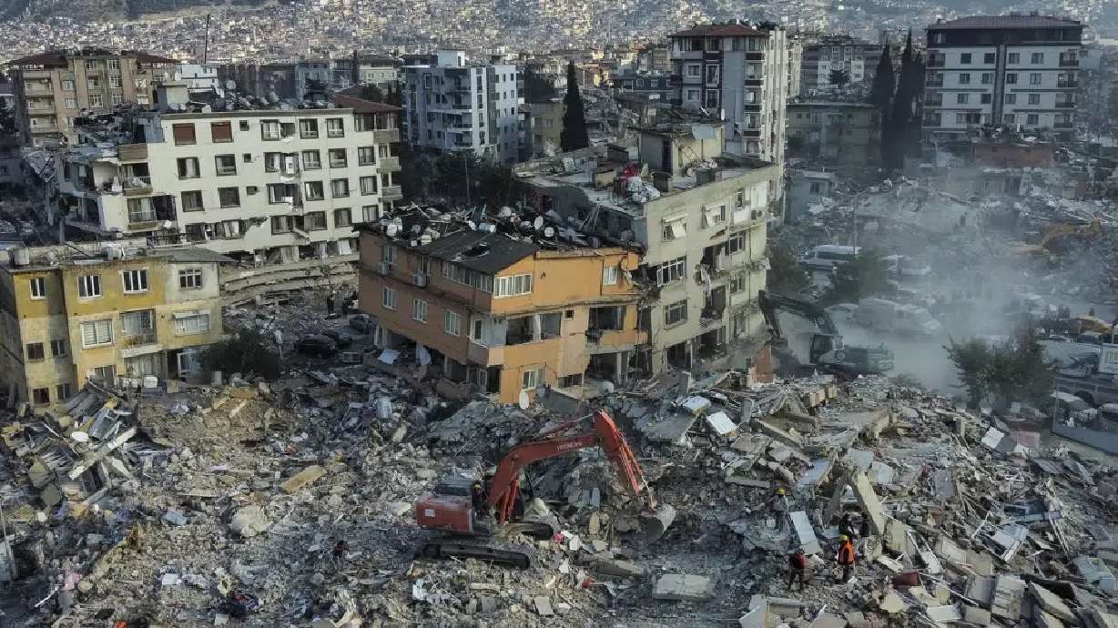 An aerial view of collapsed buildings in Antakya, southeastern Turkey, Saturday. Rescue teams using thermal cameras to locate signs of life are continuing to pull survivors out of mounds of rubble, five days after a major earthquake struck a sprawling border region of Turkey and Syria.