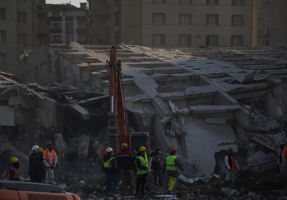 Rescue workers continue the search for victims of the earthquake in Antakya, Turkey, Saturday. Rescue crews on Saturday pulled more survivors, including entire families, from toppled buildings despite diminishing hopes as the death toll of the enormous quake that struck a border region of Turkey and Syria five days continued to rise.