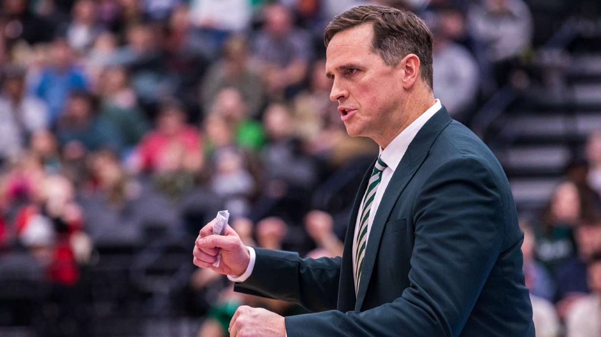 Utah Valley men's basketball head coach Mark Madsen celebrates after his team scores a basket during a matchup between UVU and Southern Utah University at the UCCU Center in Orem on Saturday, Feb. 11, 2023.