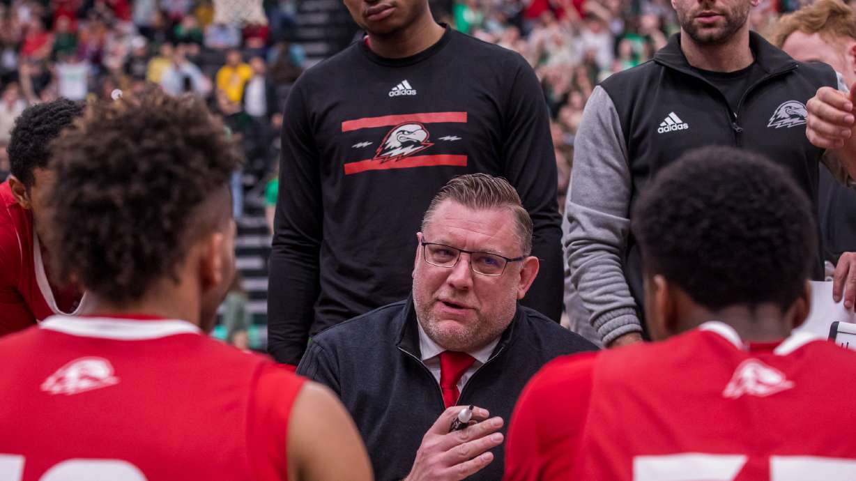 Southern Utah University men's basketball coach Todd Simon draws up a play during a timeout during a matchup between UVU and SUU at the UCCU Center in Orem on Saturday, Feb. 11, 2023.