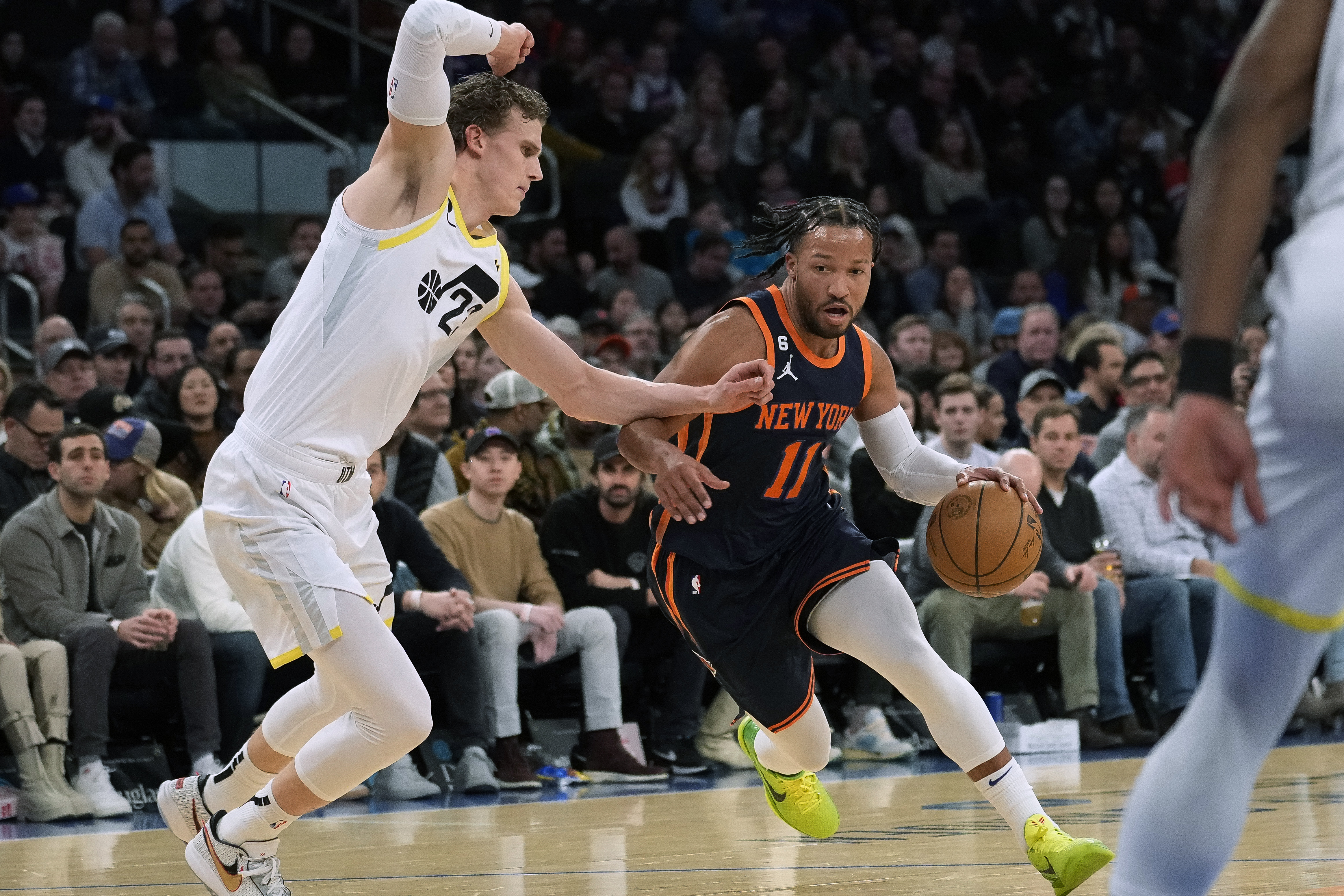 New York Knicks guard Jalen Brunson (11) drives against Utah Jazz forward Lauri Markkanen (23) during the first half of an NBA basketball game Saturday, Feb. 11, 2023, in New York. 
