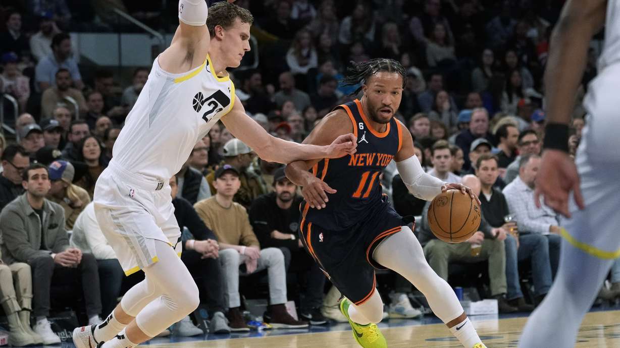 New York Knicks guard Jalen Brunson (11) drives against Utah Jazz forward Lauri Markkanen (23) during the first half of an NBA basketball game Saturday, Feb. 11, 2023, in New York.