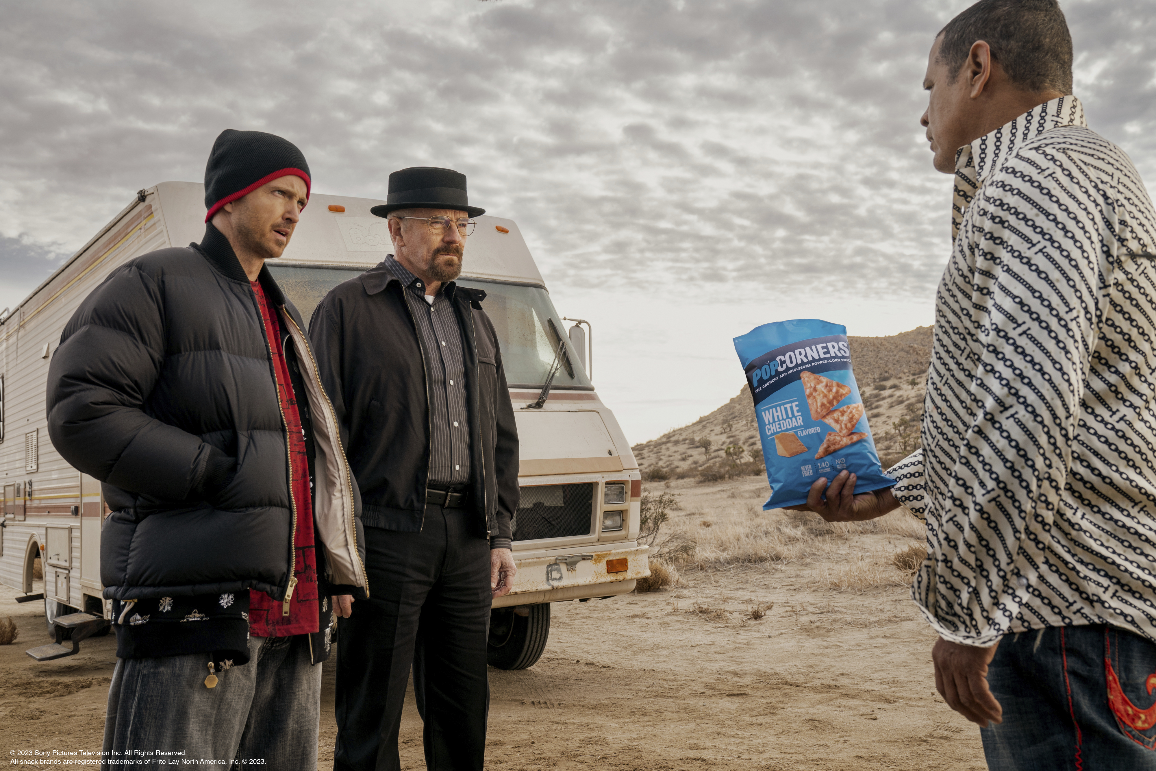 This photo provided by Frito-Lay shows Aaron Paul, Bryan Cranston and Raymond Cruz in scene from PopCorners 2023 Super Bowl NFL football spot. 