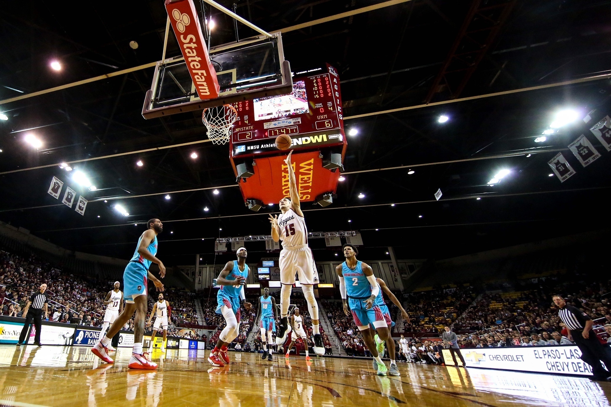 FILE - New Mexico State's Ivan Aurrecoechea shoots against New Mexico during an NCAA college basketball game Nov. 21, 2019, in Las Cruces, N.M. New Mexico State indefinitely suspended its men's basketball program Friday night, Feb. 10, 2023. The school also placed first-year coach Greg Heiar and his staff on administrative leave for what it said were violations of university policy. 