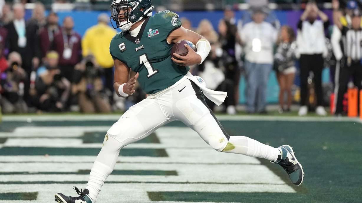 Philadelphia Eagles quarterback Jalen Hurts (1) runs into the end zone for a touchdown against the Kansas City Chiefs during the first half of the NFL Super Bowl 57 football game between the Kansas City Chiefs and the Philadelphia Eagles, Sunday, Feb. 12, 2023, in Glendale, Ariz.