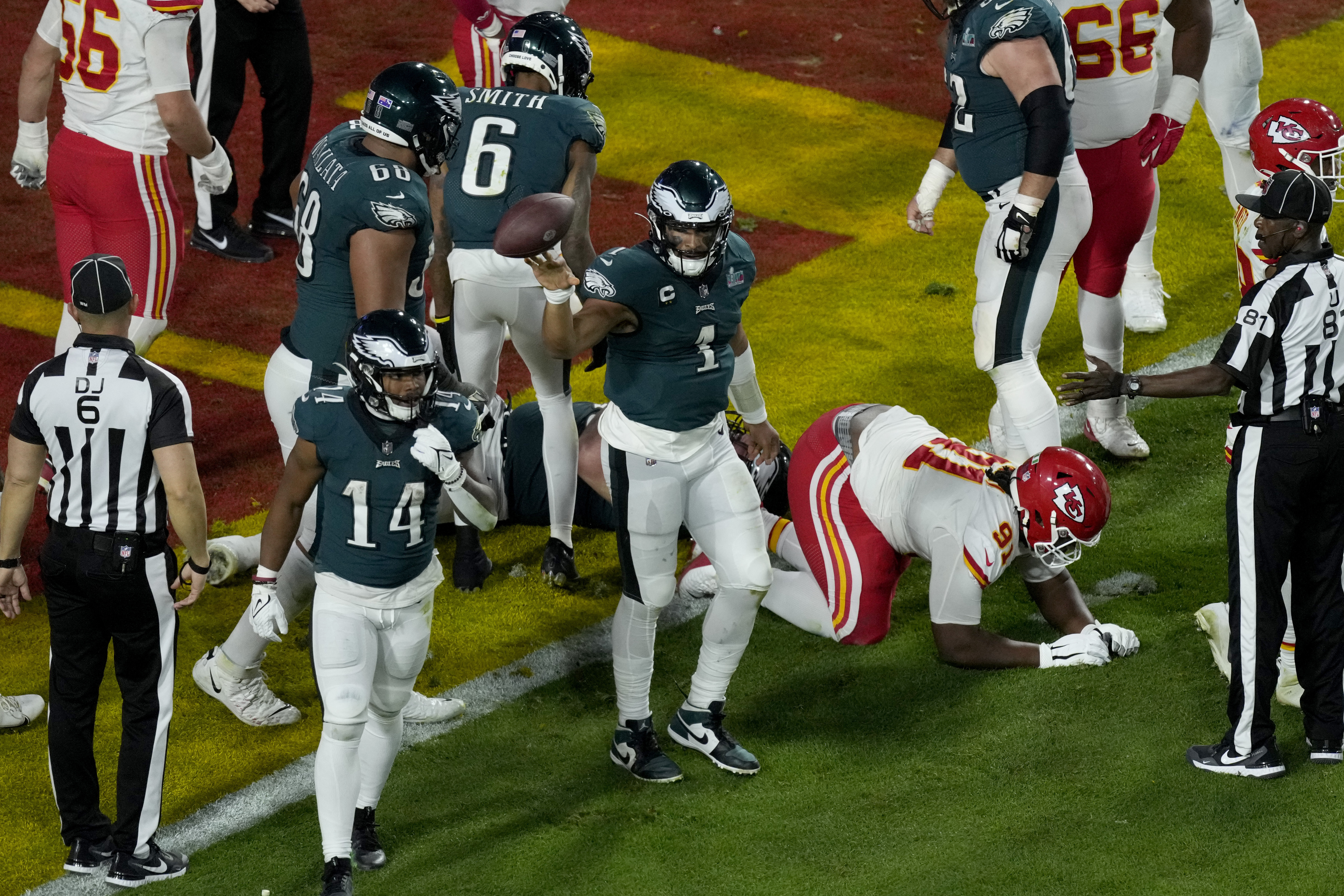 Philadelphia Eagles quarterback Jalen Hurts (1) tosses the ball after his touchdown against the Kansas City Chiefs during the second half of the NFL Super Bowl 57 football game, Sunday, Feb. 12, 2023, in Glendale, Ariz. 