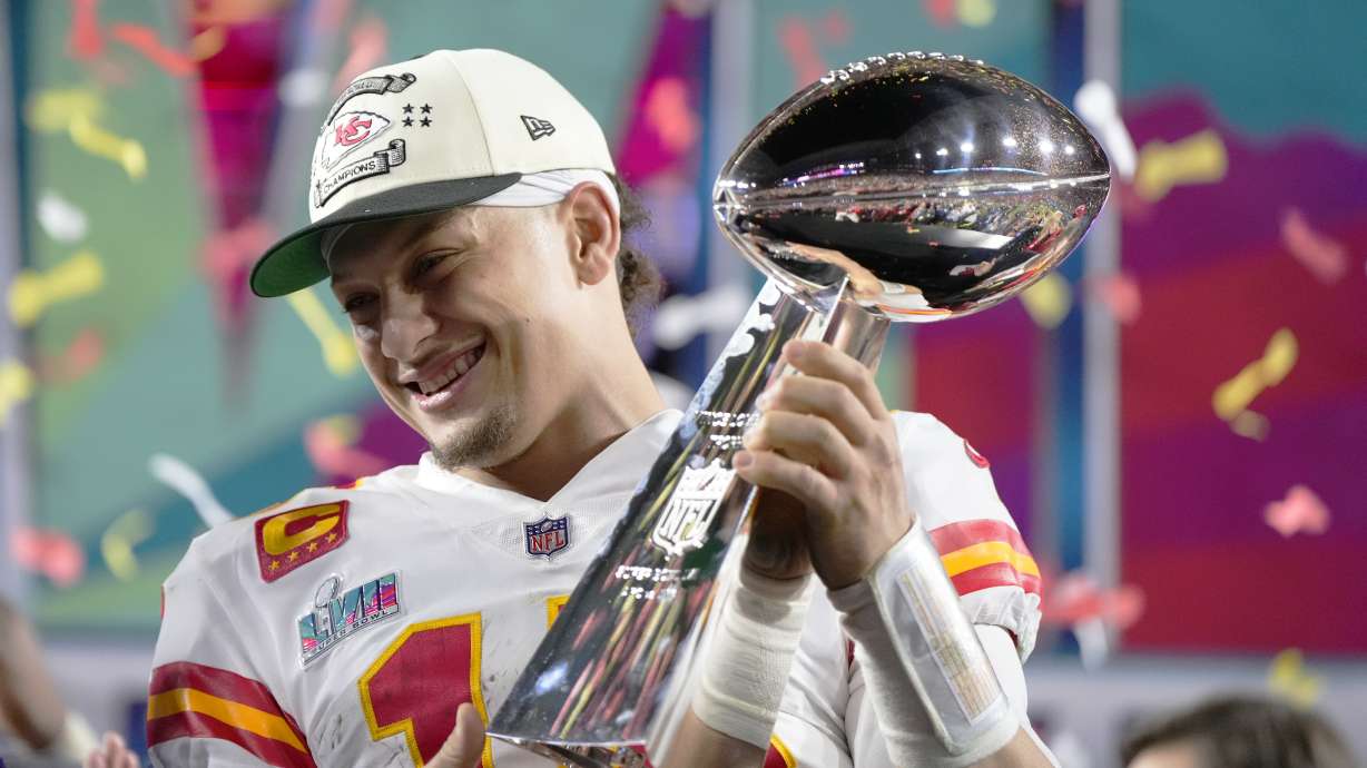 Kansas City Chiefs quarterback Patrick Mahomes (15) holds the trophy after their win against the Philadelphia Eagles in the NFL Super Bowl 57 football game, Sunday, Feb. 12, 2023, in Glendale, Ariz. The Kansas City Chiefs defeated the Philadelphia Eagles 38-35.