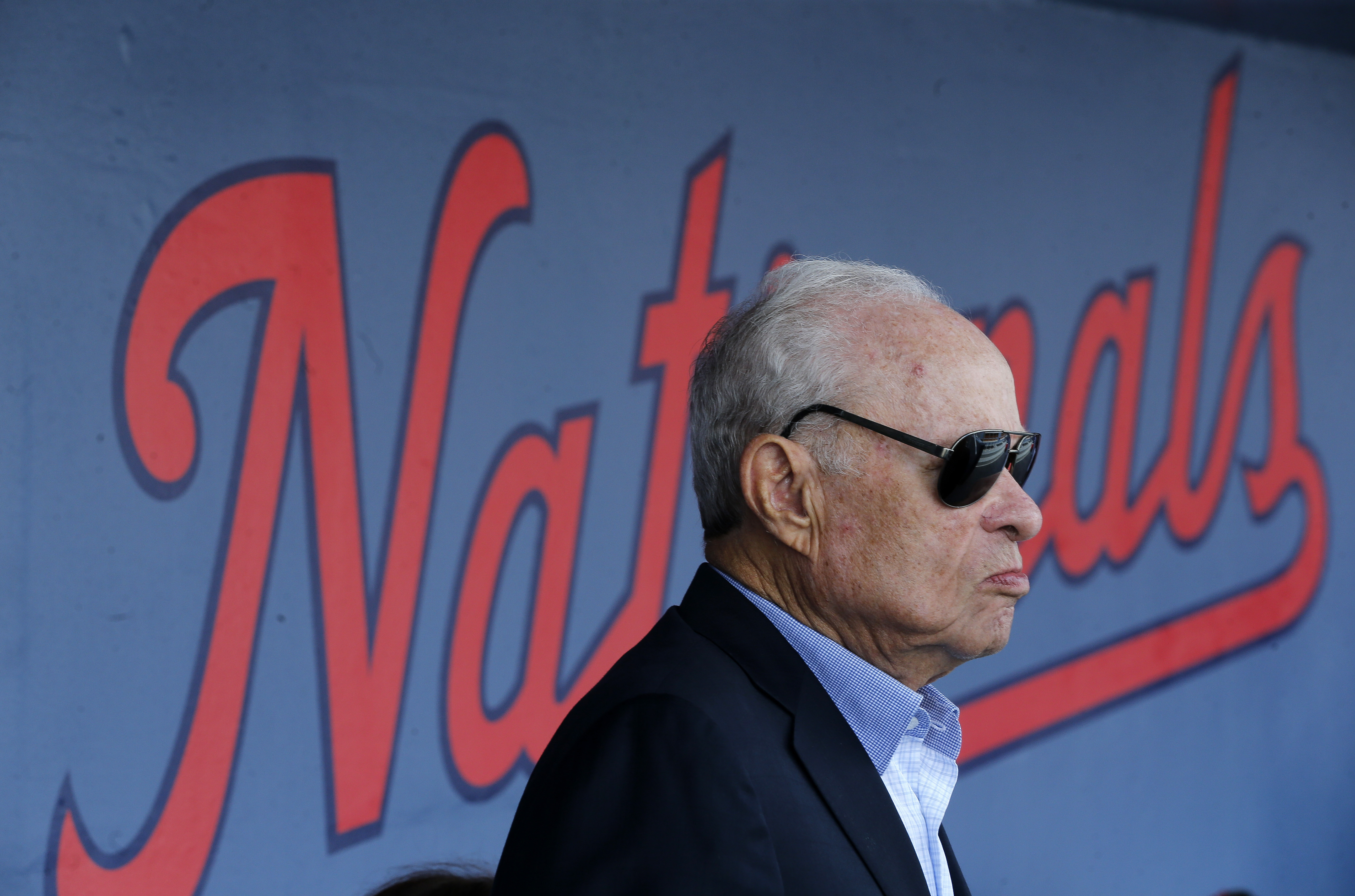 FILE - Washington Nationals owner Ted Lerner is shown in the dugout before a spring training baseball game against the Houston Astros, Feb. 28, 2017 in West Palm Beach, Fla. Washington Nationals founder Ted Lerner has died. He was 97. Lerner bought the team from Major League Baseball in 2006 for $450 million. He was managing principal owner until ceding that role to son Mark in 2018. 