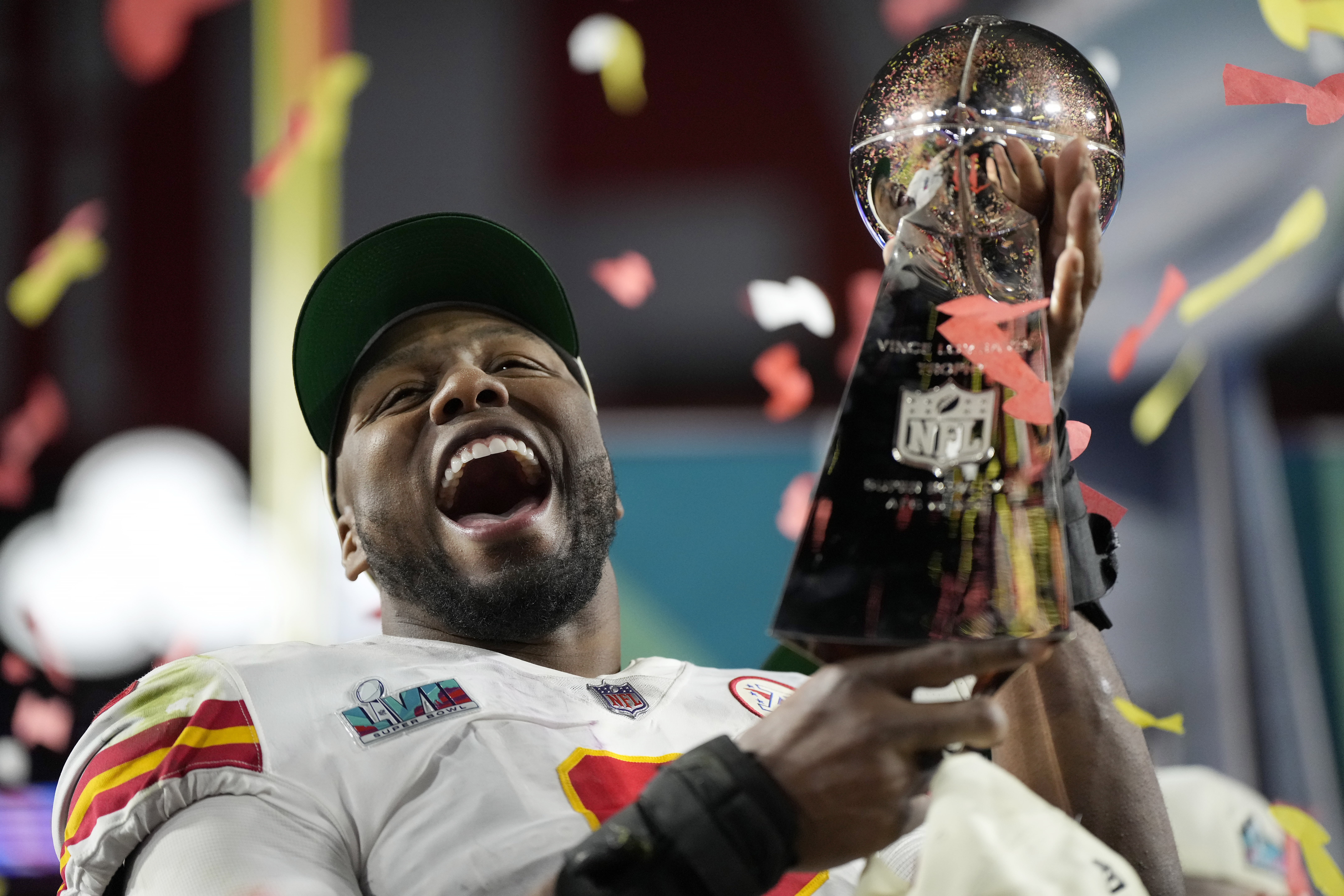Kansas City Chiefs defensive end Carlos Dunlap celebrates with the Vince Lombardi Trophy after the NFL Super Bowl 57 football game, Sunday, Feb. 12, 2023, in Glendale, Ariz. The Kansas City Chiefs defeated the Philadelphia Eagles 38-35. 