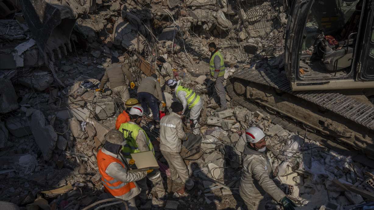 Members of a search and rescue team work on a collapsed structure after the earthquake in Antakya, southeastern Turkey, Sunday. Starting Monday, a crucial Twitter tool used by software developers to comb the platform for calls for help from earthquake victims, may be accessible only by paying a $100 monthly fee.