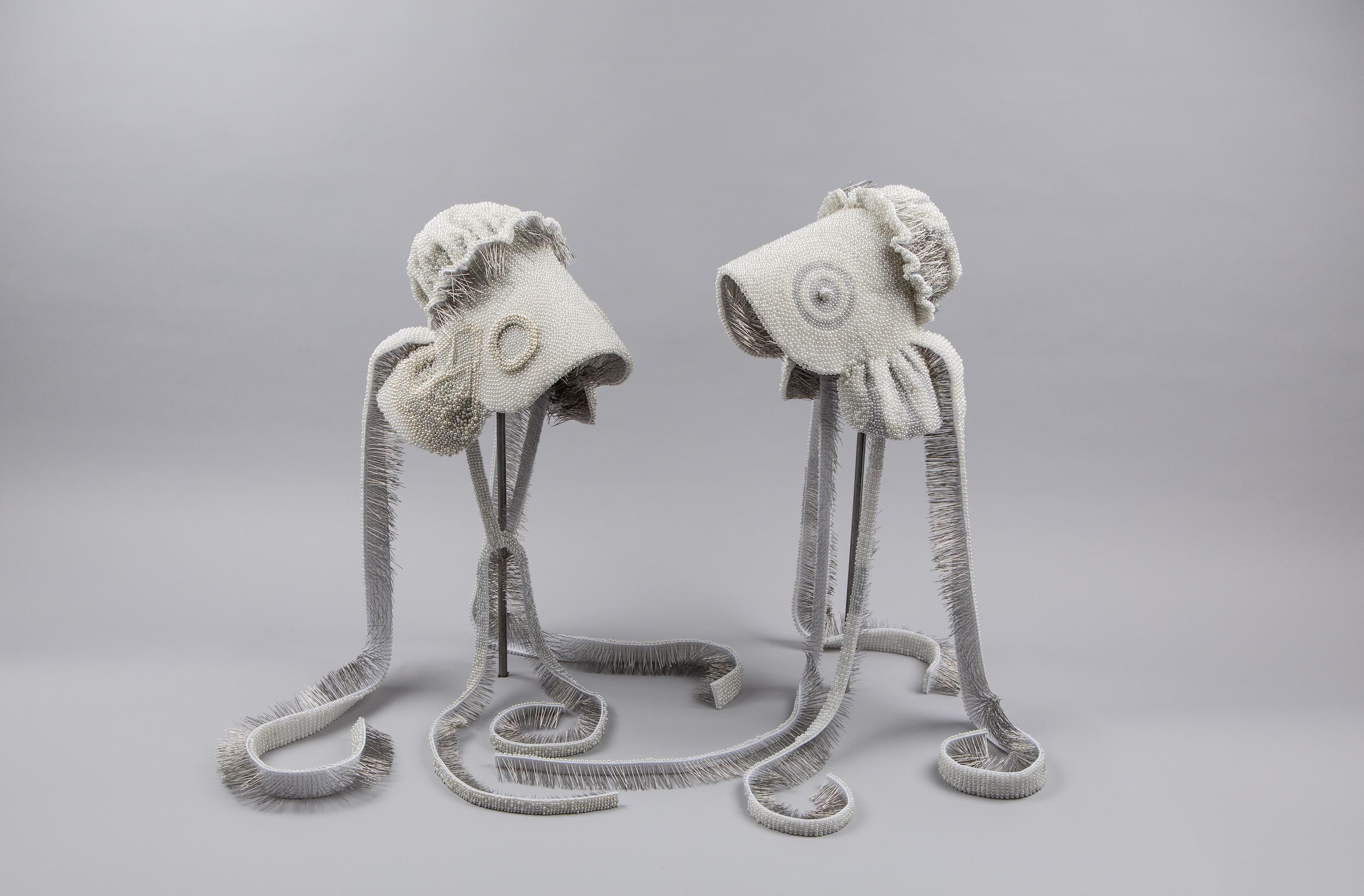 Seer Bonnet XI and XII, 2010, corsage pins, fabric and steel. The bonnets are featured in an exhibit at the Utah Museum of Fine Arts.