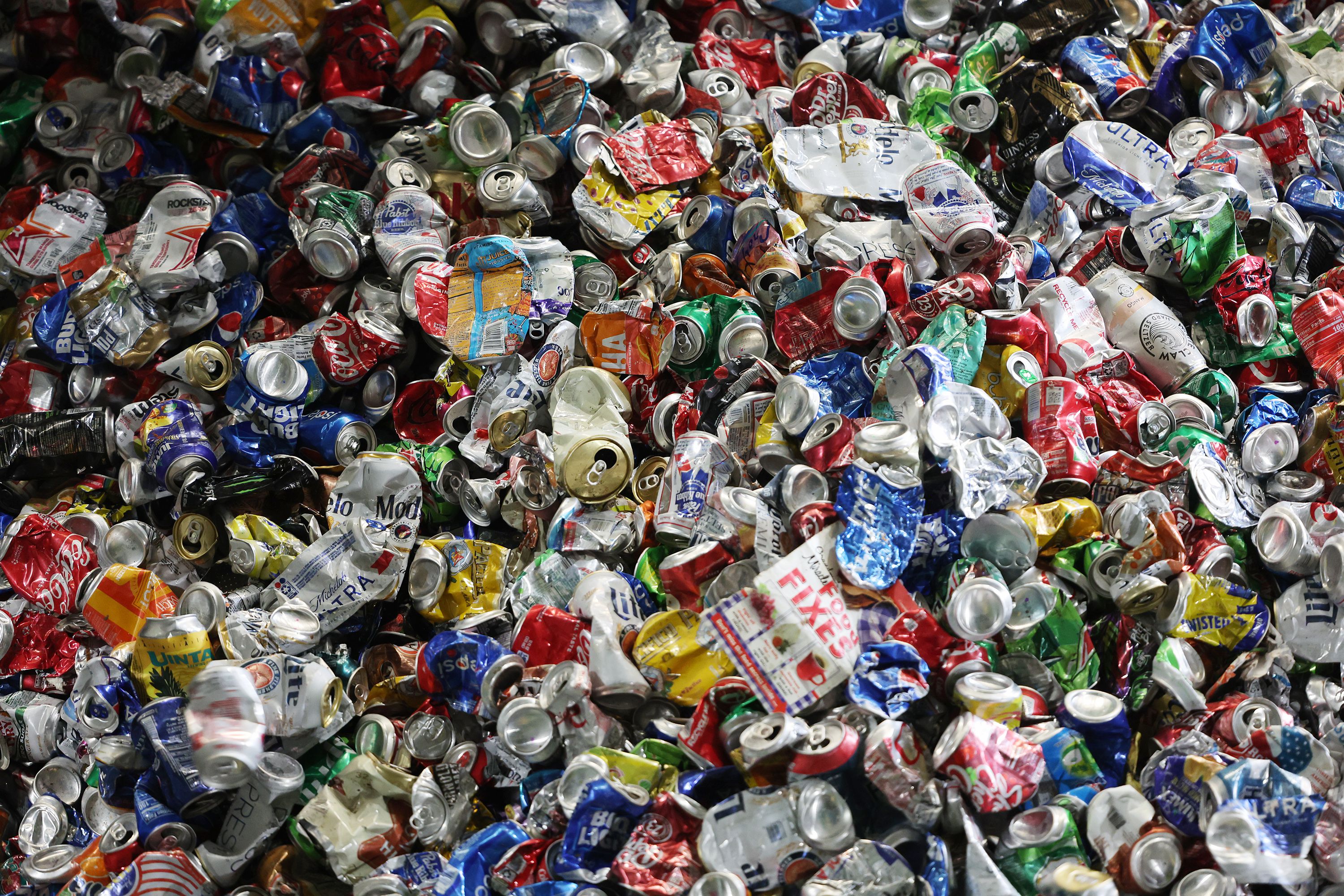 Thousands of aluminum cans stack up at the Waste Management sorting center in Salt Lake City on Monday.