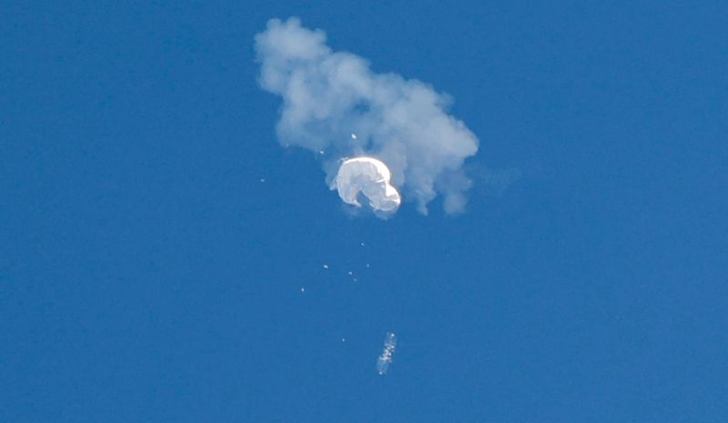 The suspected Chinese spy balloon drifts to the ocean after being shot down off the coast in Surfside Beach, S.C., Feb. 4. U.S. military said it recovered key sensors from the downed Chinese spy balloon.