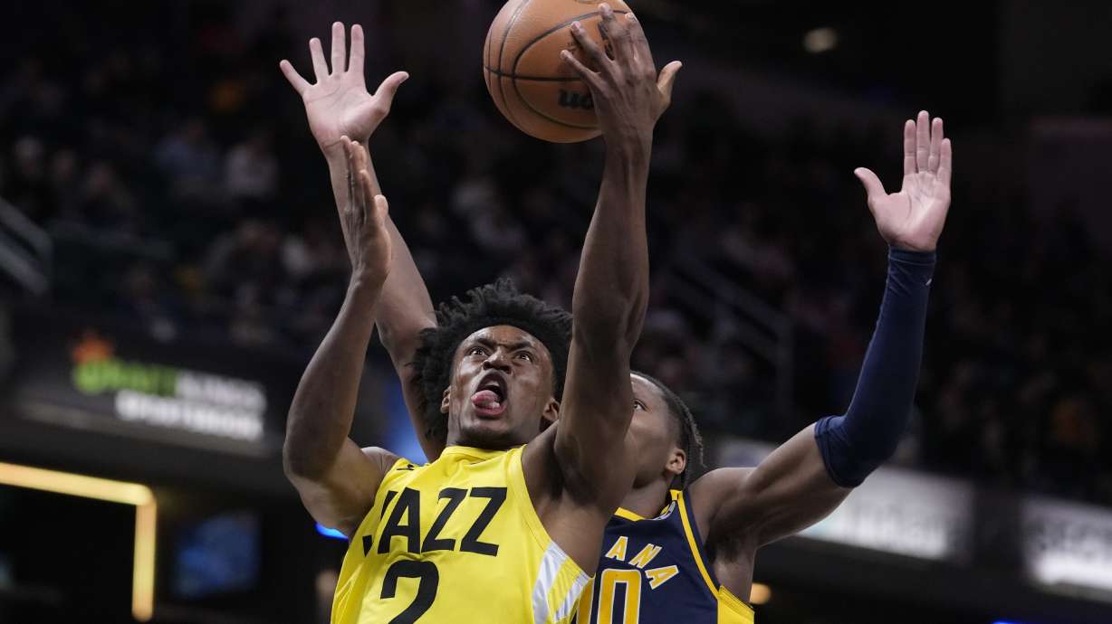 Utah Jazz guard Collin Sexton (2) shoots in front of Indiana Pacers guard Bennedict Mathurin (00) during the second half of an NBA basketball game in Indianapolis, Monday, Feb. 13, 2023. The Jazz defeated the Pacers 123-117.