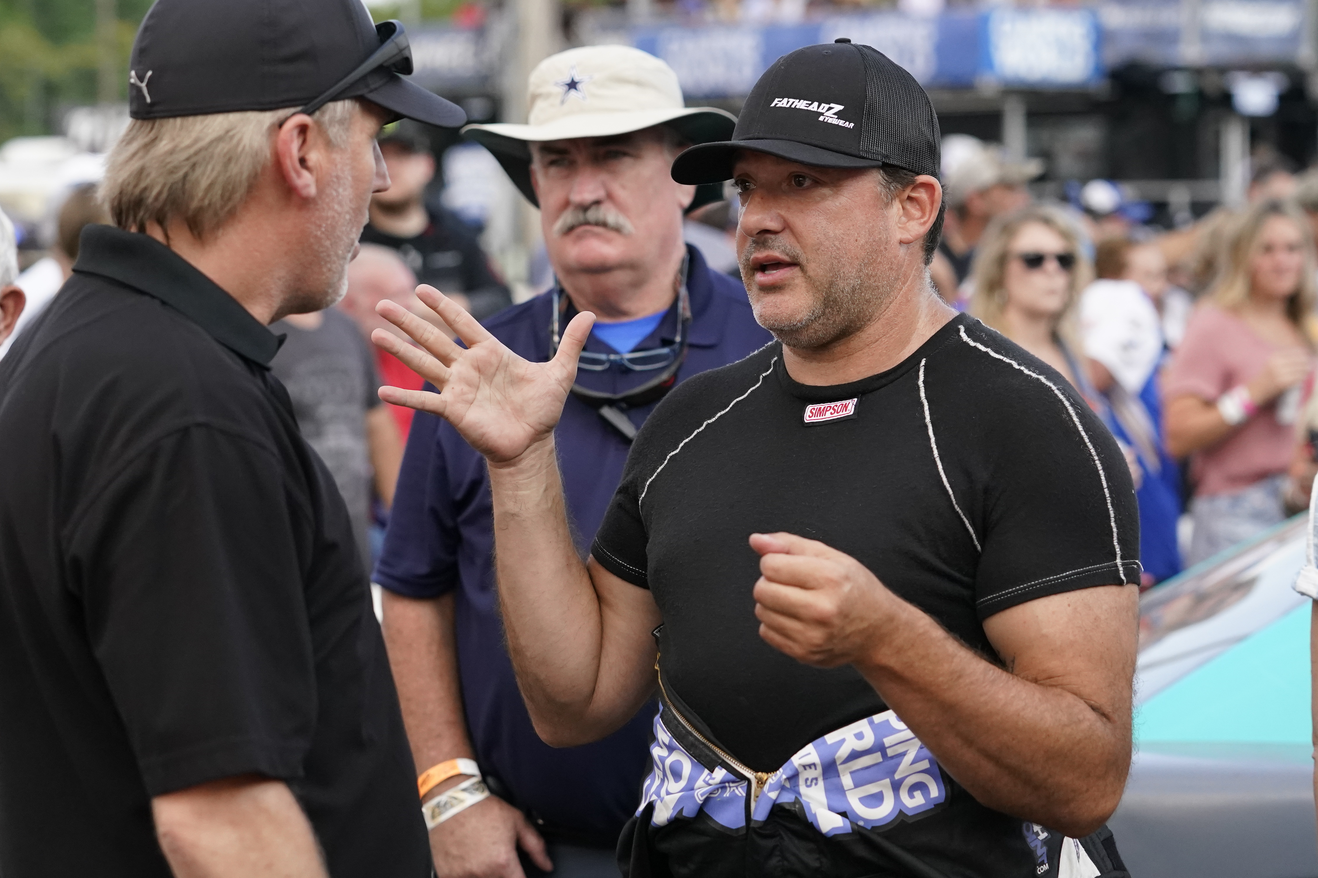 FILE - Tony Stewart, right, talks before an SRX Series auto race in Nashville, Tenn., July 17, 2021. Hall of Famer Stewart will return to full-time competition this season — as an NHRA drag racer. The three-time NASCAR champion will run a Top Alcohol dragster for McPhillips Racing for the full 2023 NHRA season. 