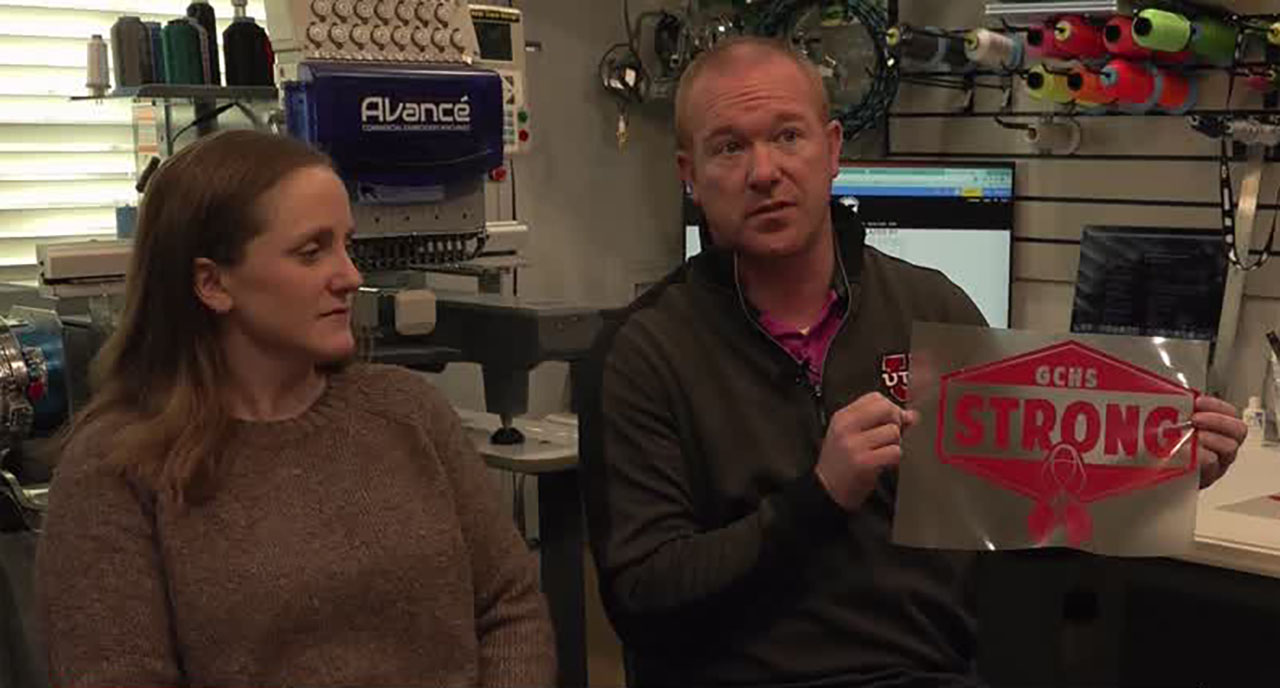 Brennon Woodward and family talk to KSL Monday in Spanish Fork. The owners of Blue Gecko Apparel sell $10 T-shirts to raise money for the family of 17-year-old Zoe McKinney, who died after falling approximately 30 feet while hiking in Moab.