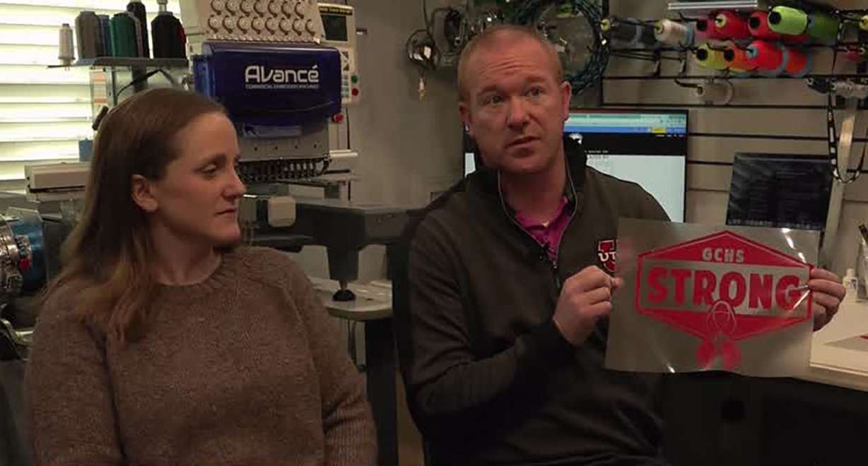 Brennon Woodward and family talk to KSL Monday in Spanish Fork. The owners of Blue Gecko Apparel sell $10 T-shirts to raise money for the family of 17-year-old Zoe McKinney, who died after falling approximately 30 feet while hiking in Moab.