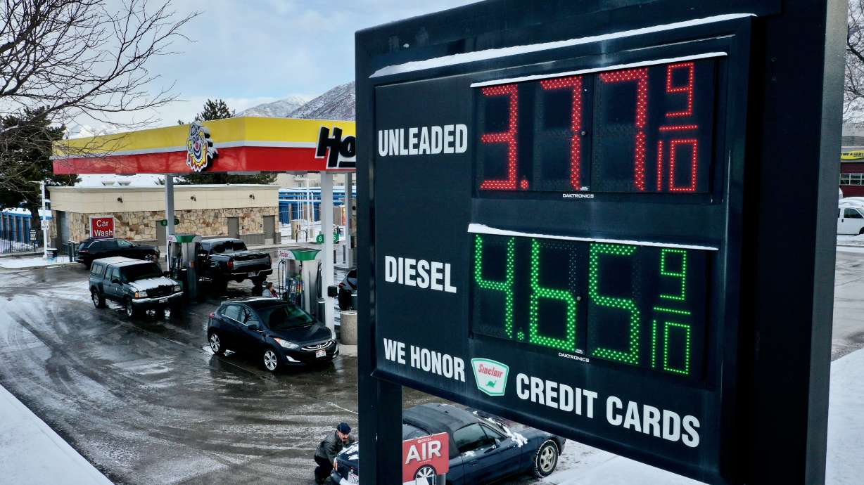 Cars fuel up at a Cottonwood Heights gas station Tuesday. Overall U.S. inflation stretched its streak of declines to seven straight months in January and now stands at 6.4% in the last 12 months.