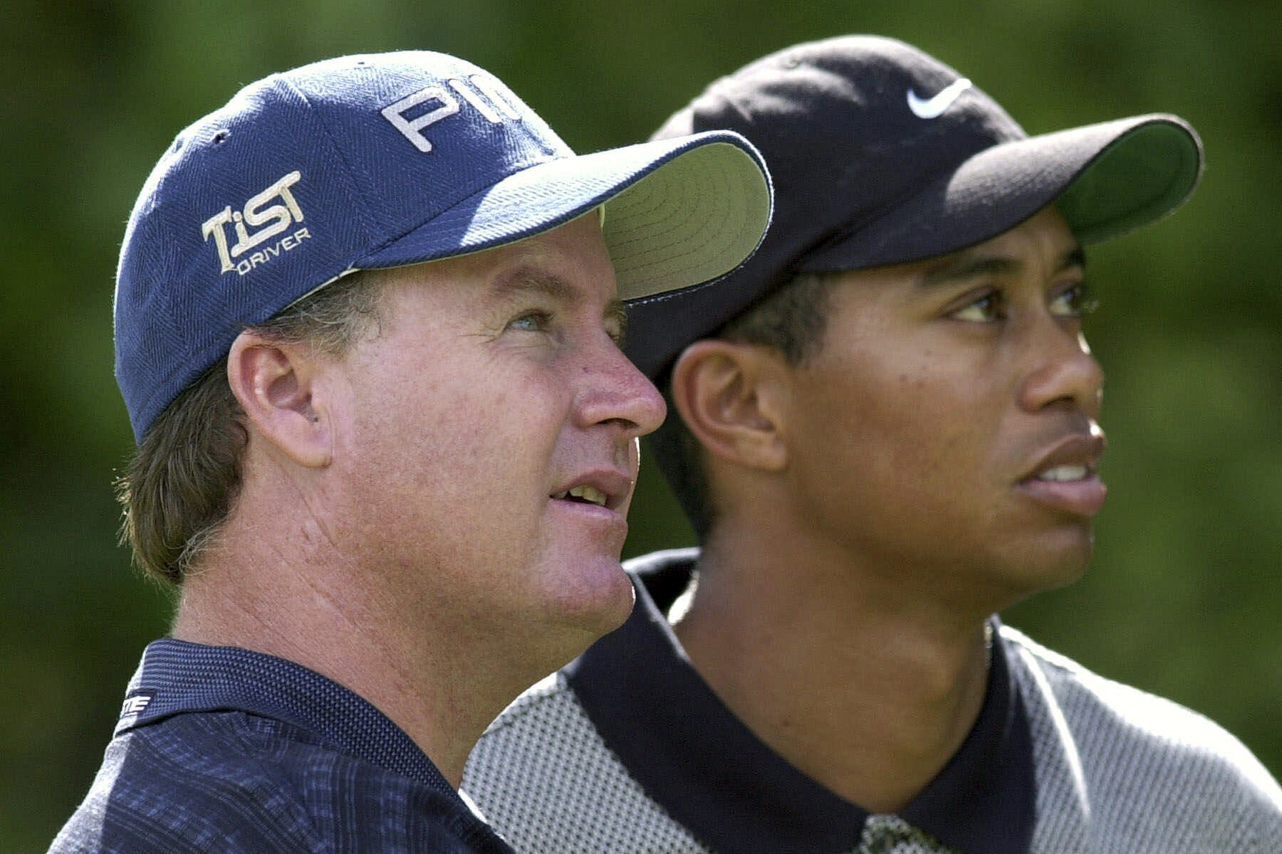 FILE - Bob May, of Las Vegas, Nev., left, along with with Tiger Woods, watches a tee shot fall on the seventh fairway during the National Car Rental Golf Classic at Walt Disney World in Lake Buena Vista, Fla., on Oct. 26, 2000. May was a journeyman from California who challenged Woods like no one else could in the summer of 2000. 
