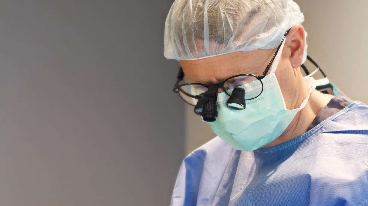 Dr. Travis Peterson performing surgery.