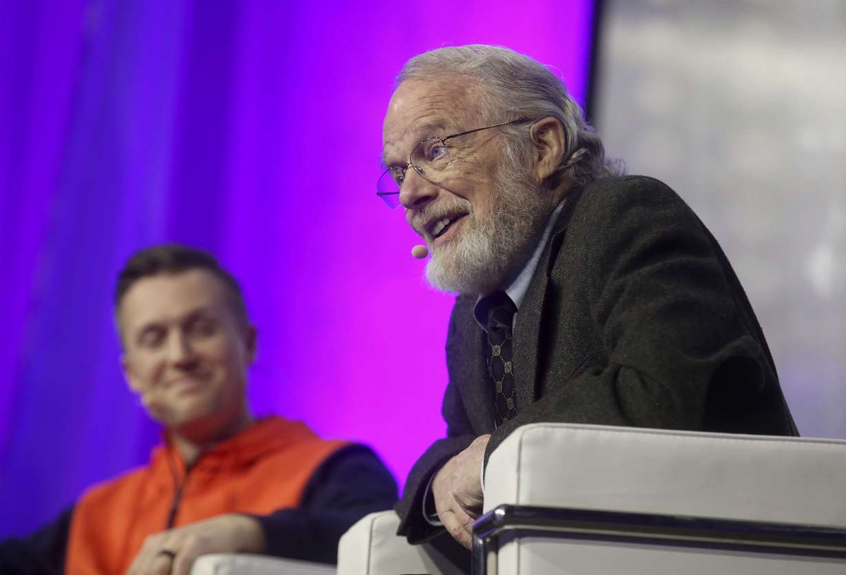 Podium.com CEO Eric Rea, left, listens to John Warnock, Adobe founder, during the Silicon Slopes Tech Summit at the Salt Palace Convention Center in Salt Lake City on Feb. 1, 2019.