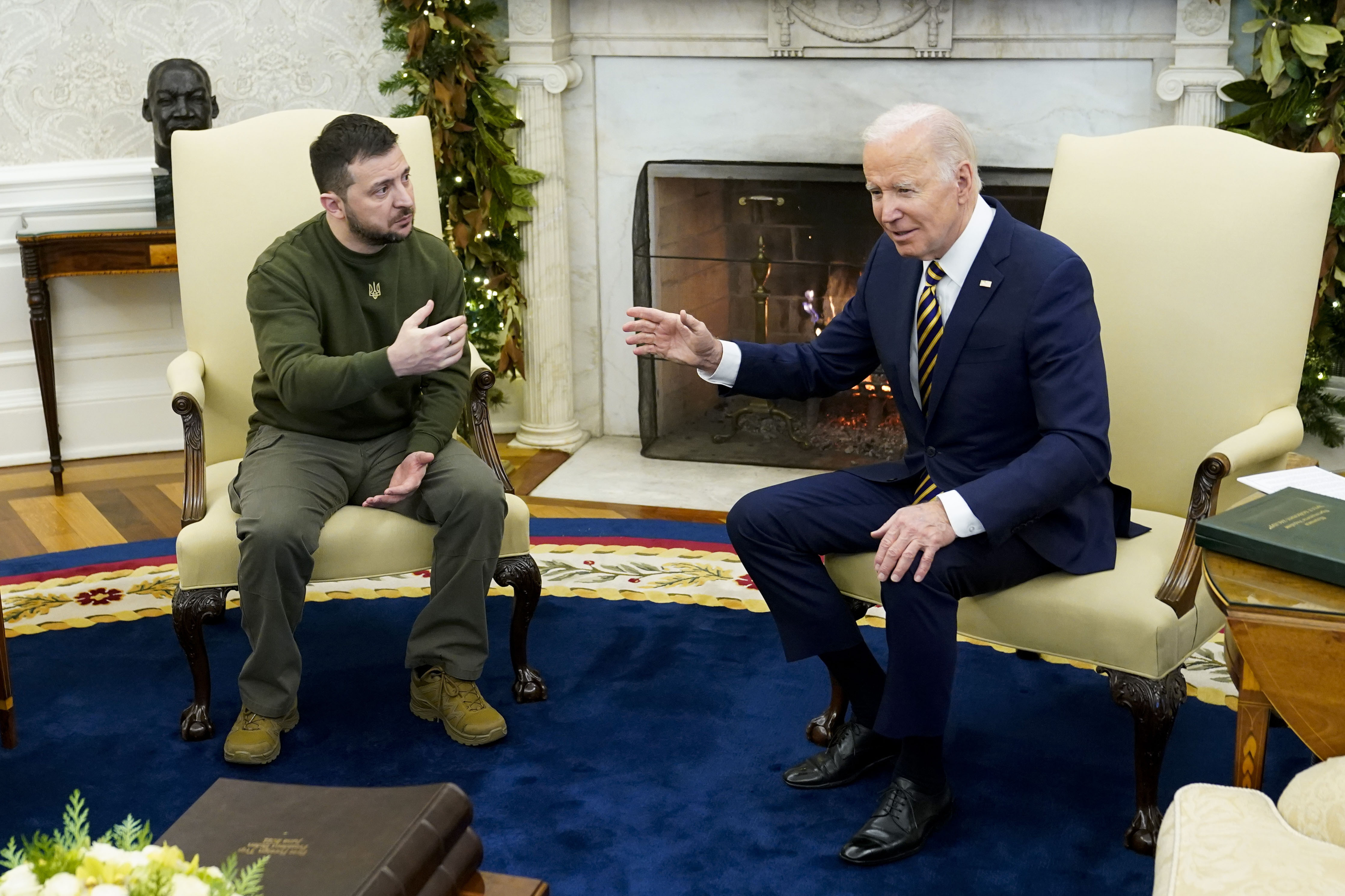 President Joe Biden speaks with Ukrainian President Volodymyr Zelenskyy as they meet in the Oval Office of the White House, Dec. 21, 2022, in Washington. Support among the American public for providing Ukraine weaponry and direct economic assistance has softened as the Russian invasion nears a grim one-year milestone. 