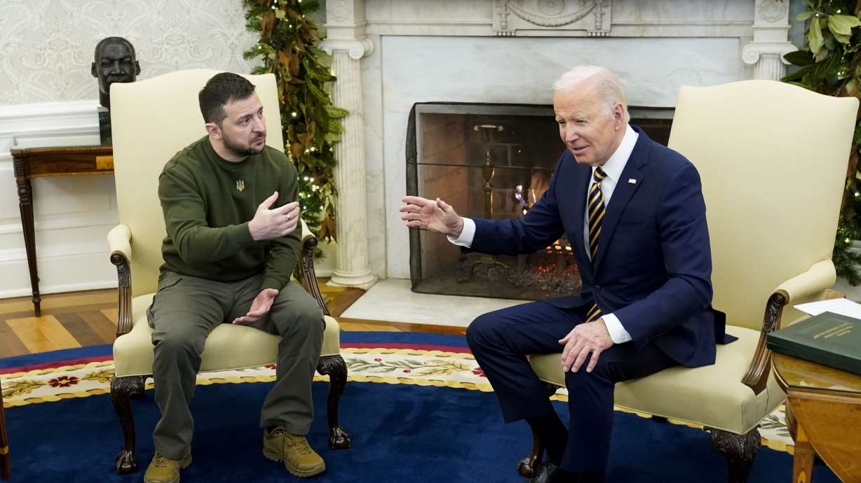 President Joe Biden speaks with Ukrainian President Volodymyr Zelenskyy as they meet in the Oval Office of the White House, Dec. 21, 2022, in Washington. Support among the American public for providing Ukraine weaponry and direct economic assistance has softened as the Russian invasion nears a grim one-year milestone.