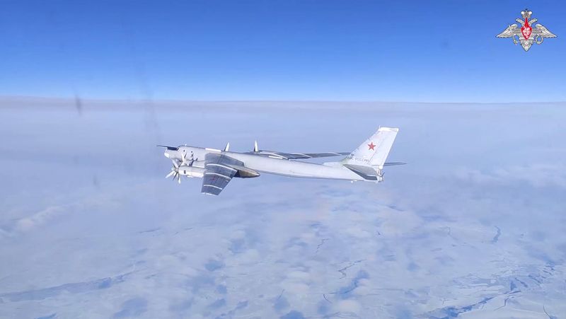 A Russian Tu-95MS strategic bomber performs a flight over the neutral waters of the Bering Sea, in this still image taken from a handout video released Feb. 14.