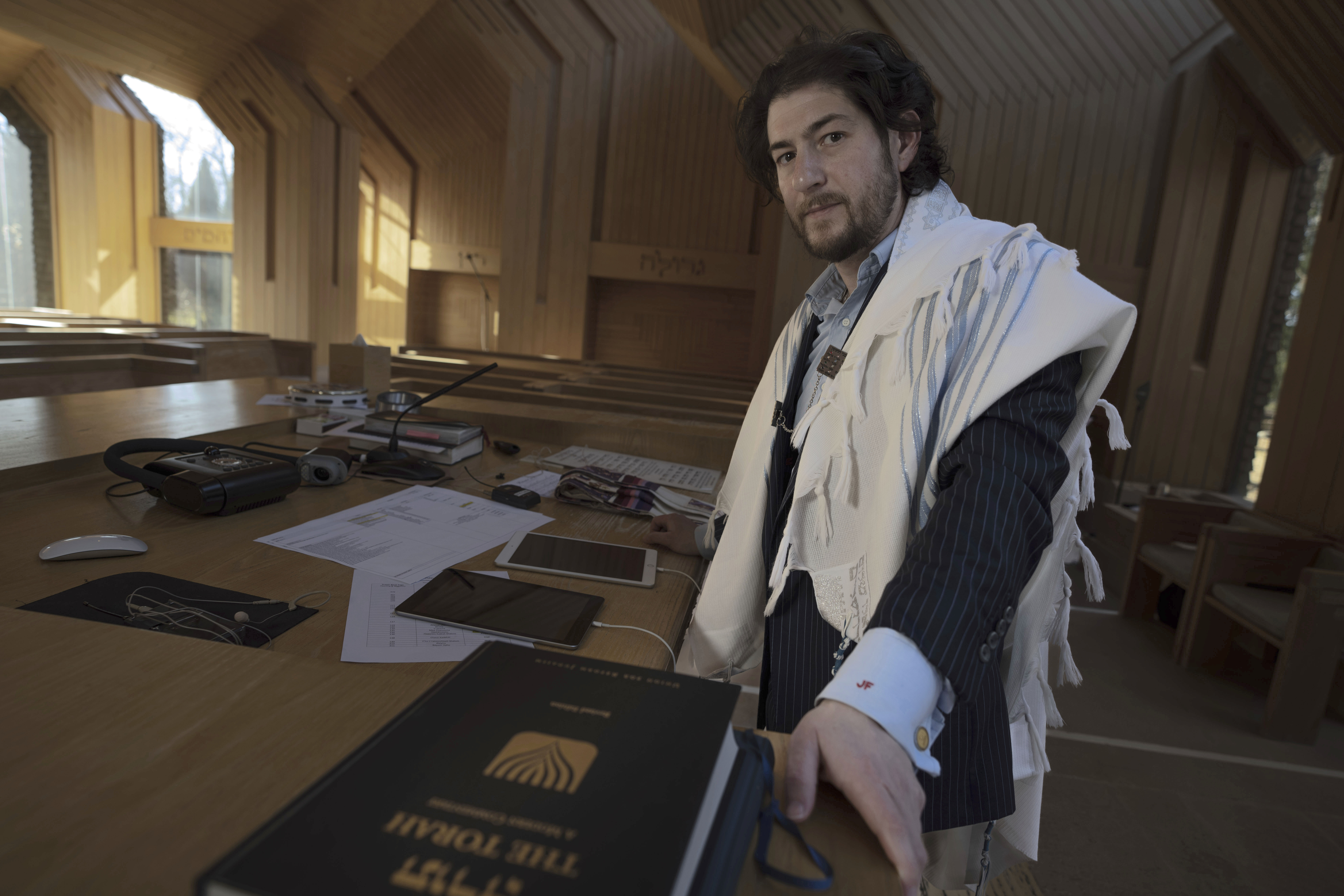 Rabbi Joshua Franklin stands inside the sanctuary at the Jewish Center of the Hamptons in East Hampton, N.Y., Friday. Franklin experimented with writing a sermon for his congregation using artificial intelligence software Chat GPT and concluded that AI can't replace the work of human faith leaders.