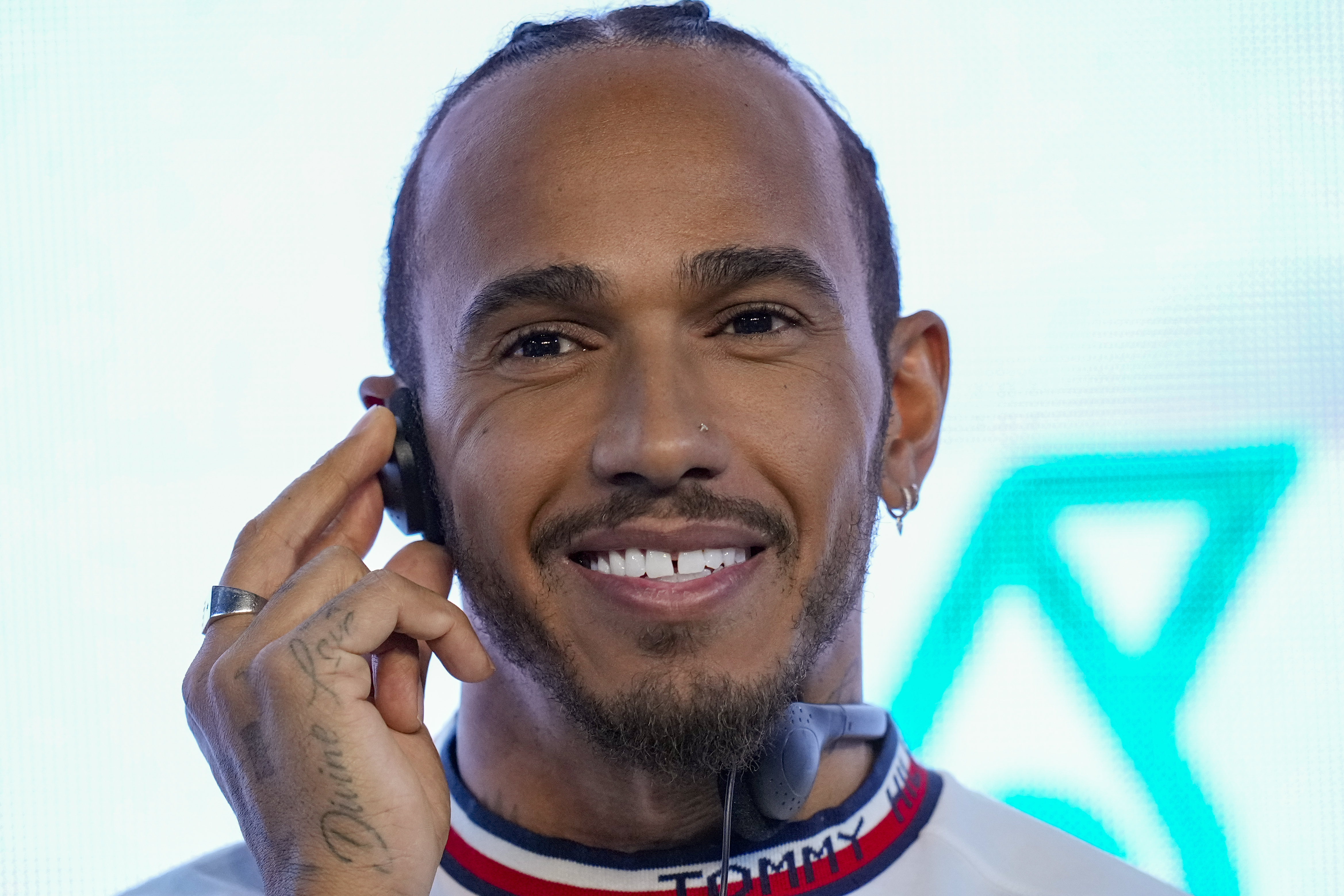FILE - Mercedes driver Lewis Hamilton of Britain listens to a question during a press conferencein Sao Paulo, Brazil, on Nov. 9, 2022. Seven-time Formula One champion Lewis Hamilton insisted he will not be silenced by offseason rules that prohibit drivers from speaking out on political issues. Hamilton said Wednesday Feb. 15, 2023 he will continue to use his global platform to promote his wide-ranging interests, which include social justice and race, human rights and protection of the LBGTQ community. 