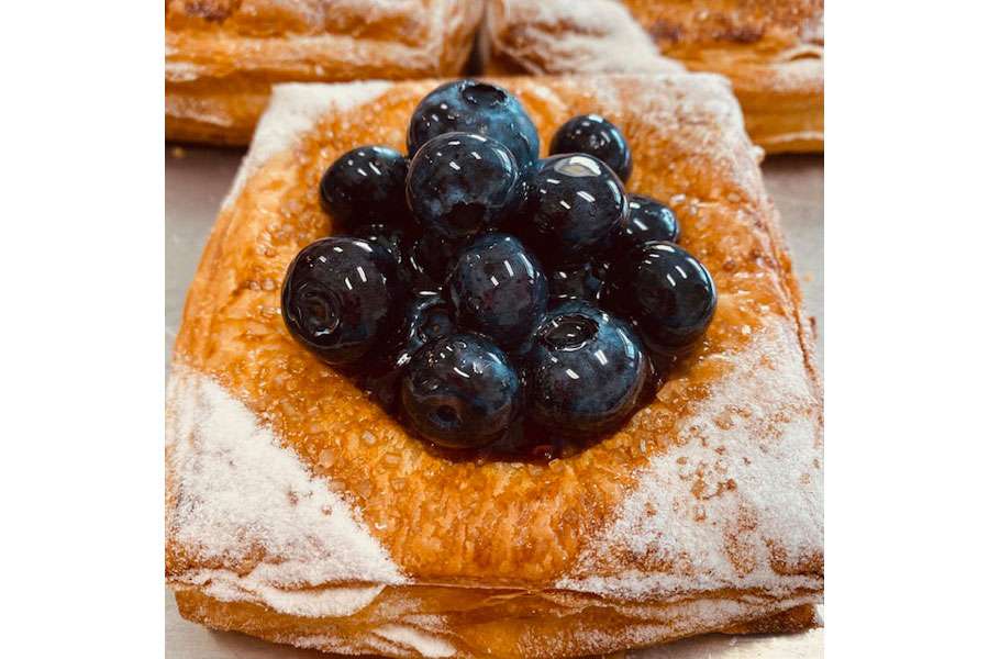Blueberry danishes are among the baked delicacies at a Malad, Idaho bakery run by a Utah State graduate.