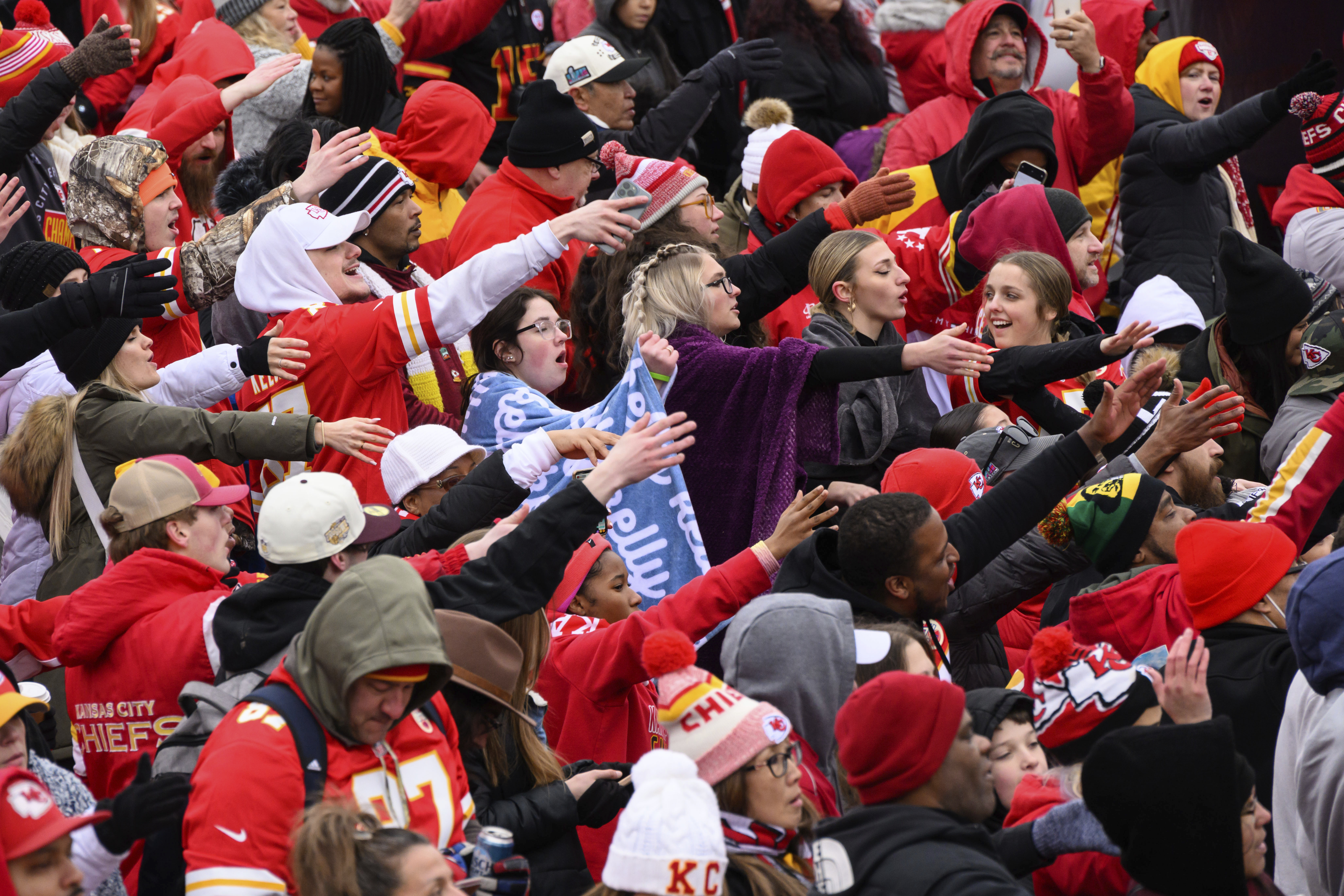 Fans do the tomahawk chop during the Kansas City Chiefs' victory celebration and parade in Kansas City, Mo., Wednesday, Feb. 15, 2023, following the Chiefs' win over the Philadelphia Eagles Sunday in the NFL Super Bowl 57 football game. 