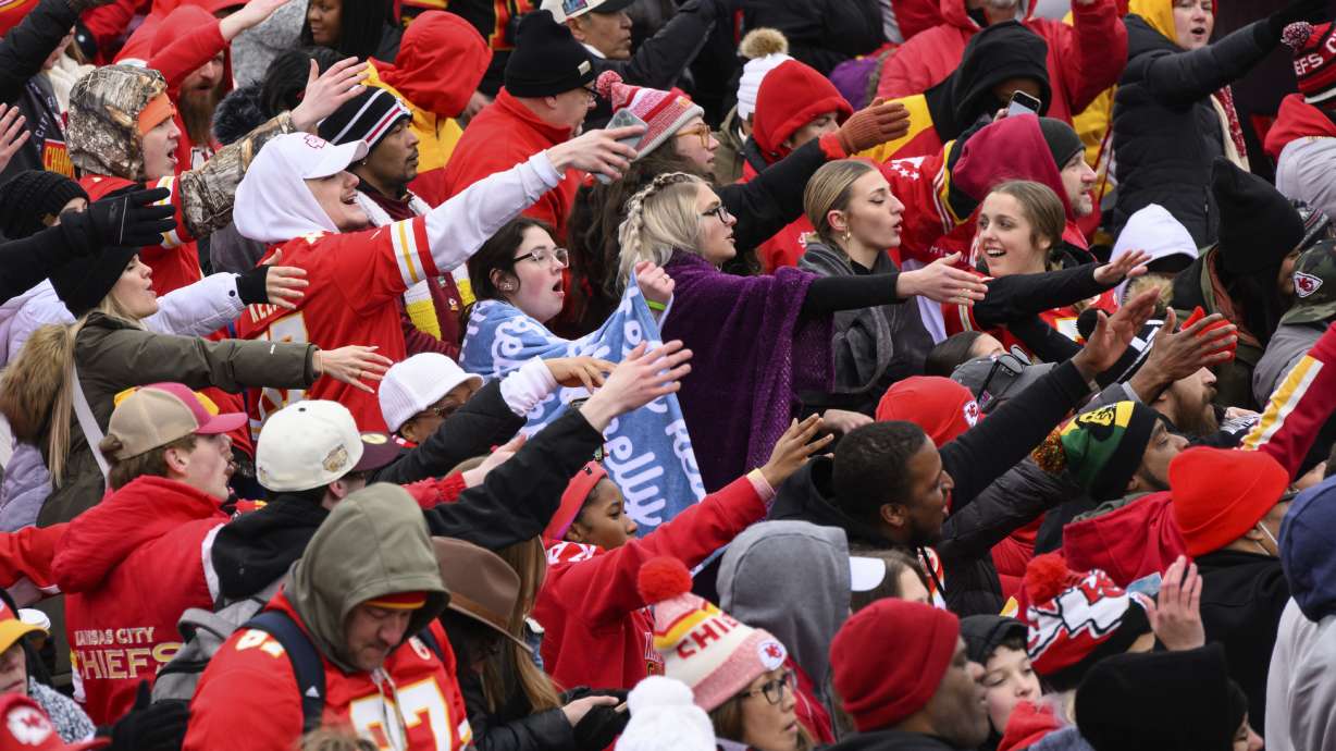 Fans do the tomahawk chop during the Kansas City Chiefs' victory celebration and parade in Kansas City, Mo., Wednesday, Feb. 15, 2023, following the Chiefs' win over the Philadelphia Eagles Sunday in the NFL Super Bowl 57 football game.