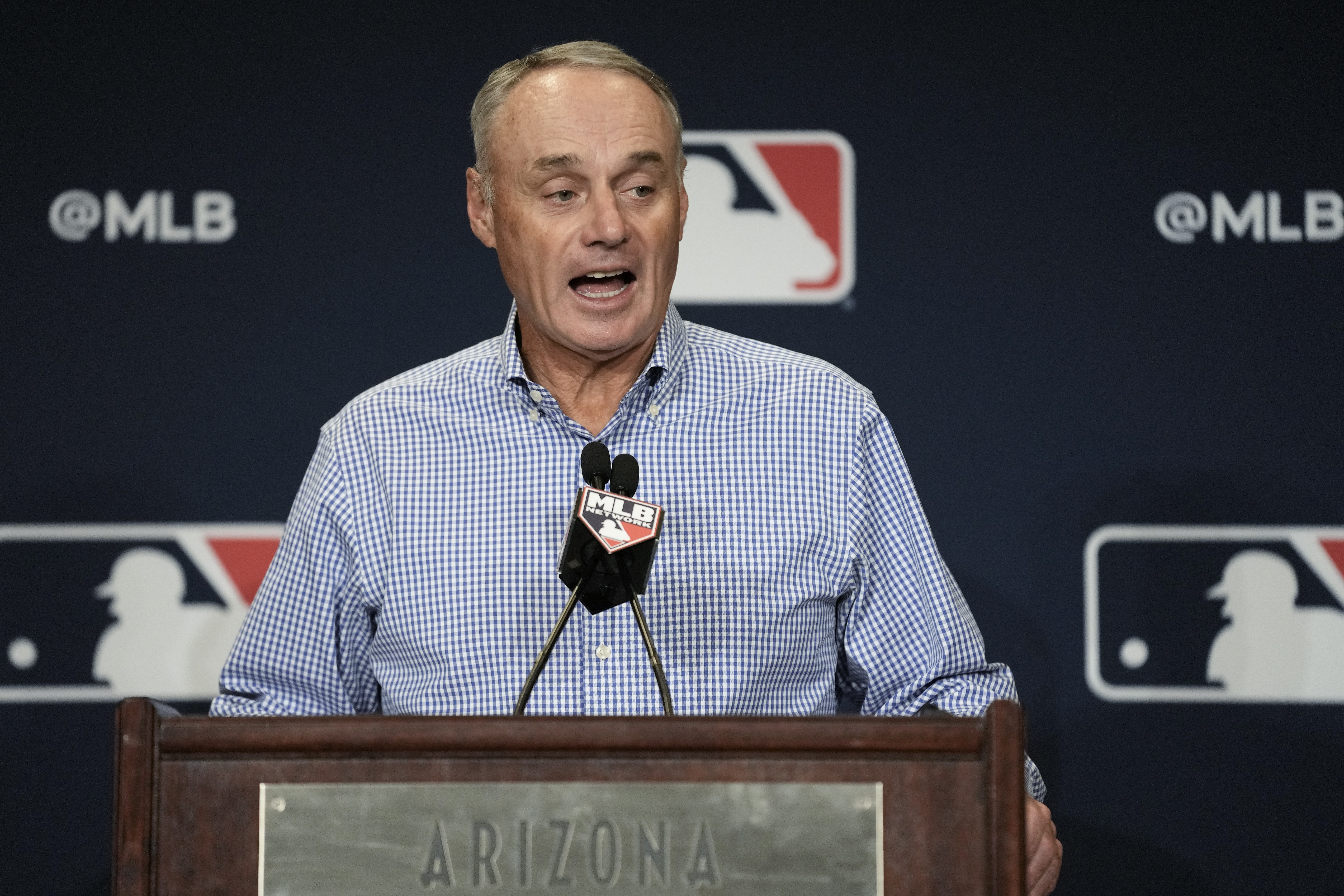 Major League Baseball Commissioner Robert Dean Manfred Jr. answers questions at spring training media day Wednesday, Feb. 15, 2023, in Phoenix. 