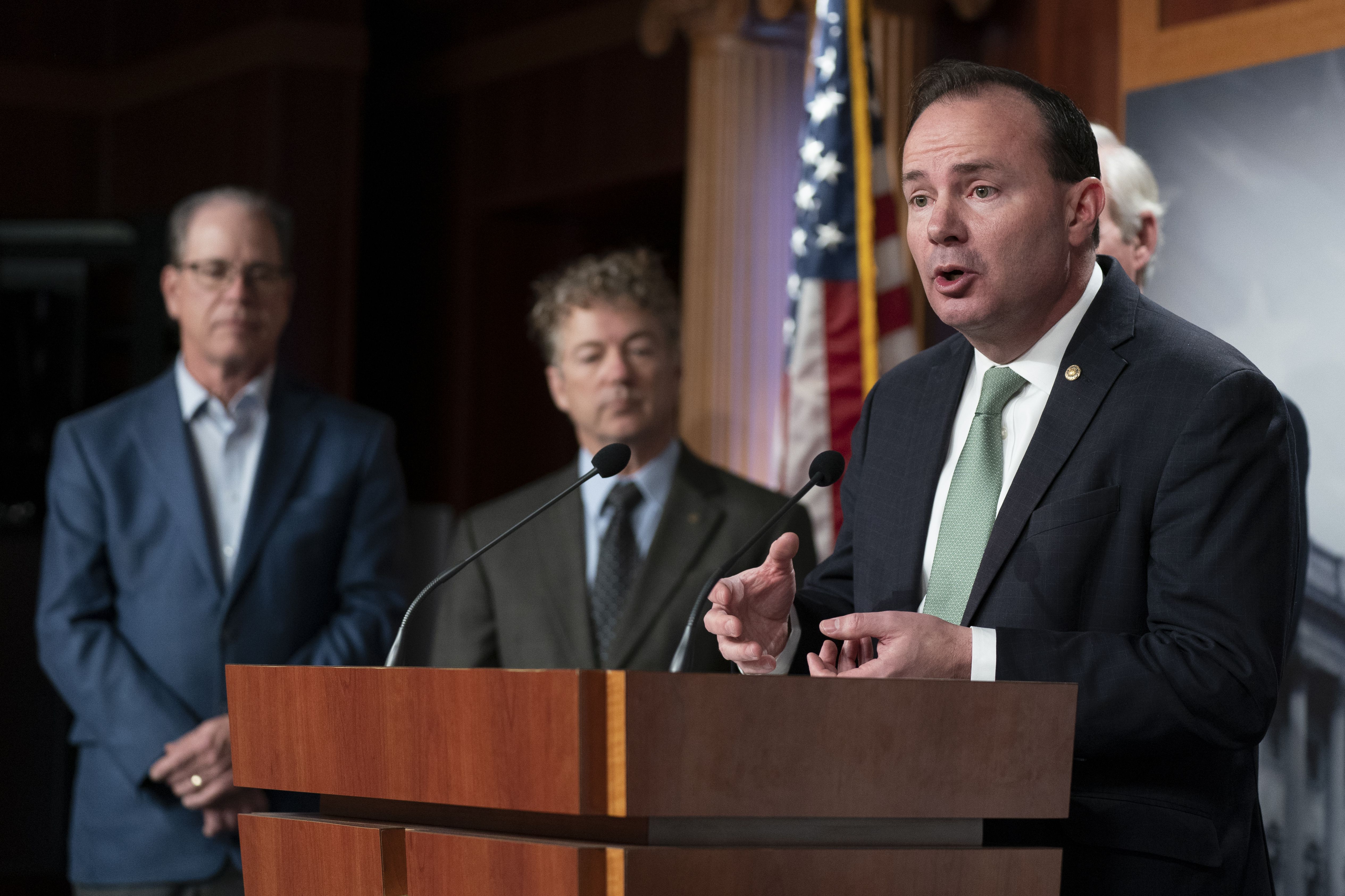 Sen. Mike Lee, R-Utah, from right, with Sens. Rand Paul, R-Ky., and Mike Braun, R-Ind., talks about the nation’s debt ceiling during a news conference on Capitol Hill in Washington, Jan. 25. Lee on Wednesday warned against "climate alarmism" in his first meeting as a member of the Senate Budget Committee.