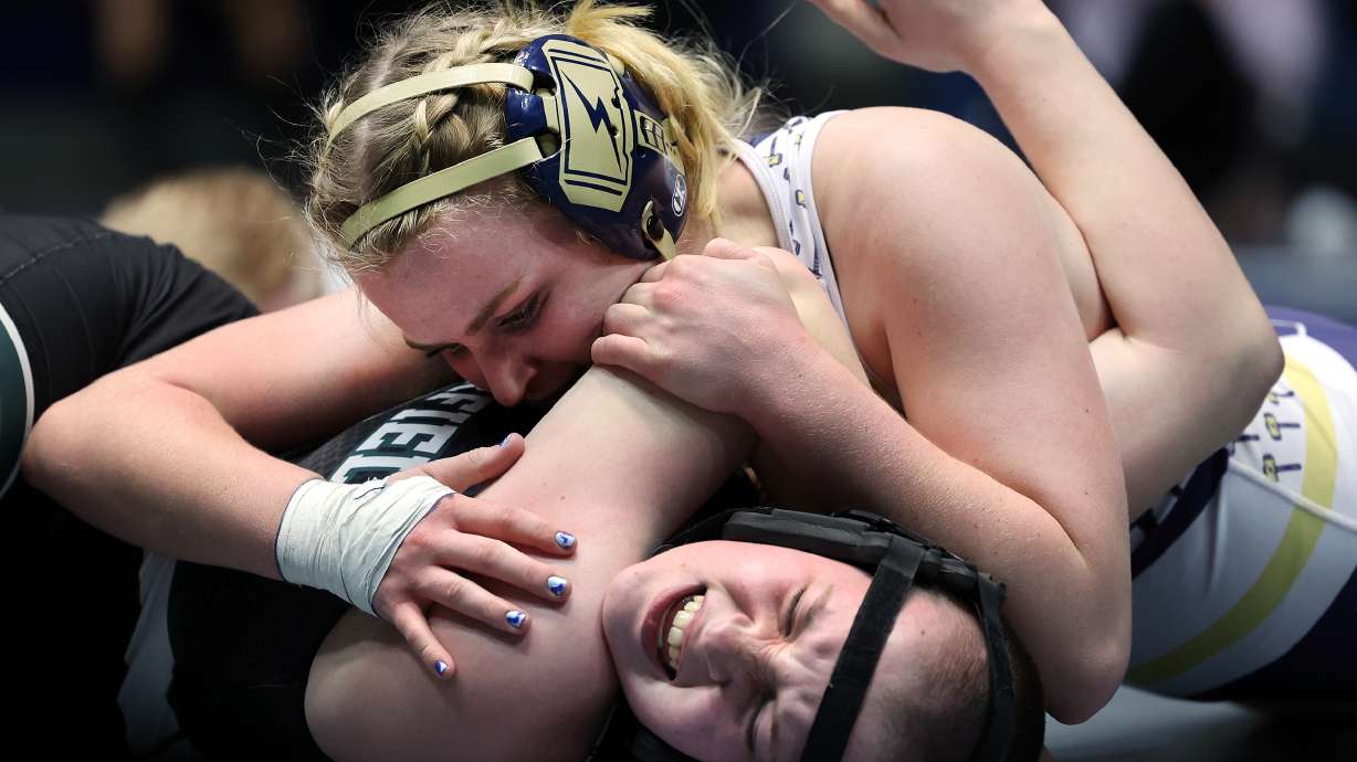 Emmy Finlinson, of Westlake High School, wrestles Alyxandra “Alyx” Walker, of Clearfield High School, in class 150 during the 6A girls state wrestling championship at West Lake High School in Saratoga Springs on Monday, Feb. 15, 2021.