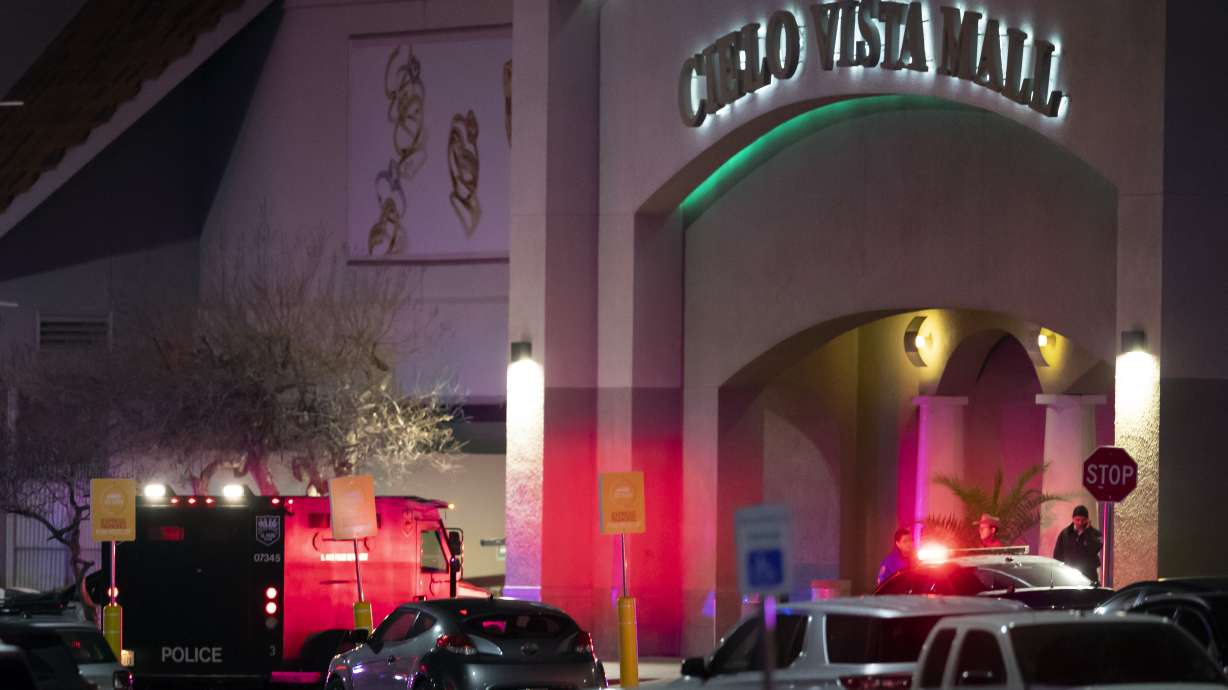 Law enforcement agents are seen at an entrance of a shopping mall, Wednesday, in El Paso, Texas. Police say one person was killed and three other people were wounded in a shooting at Cielo Vista Mall.