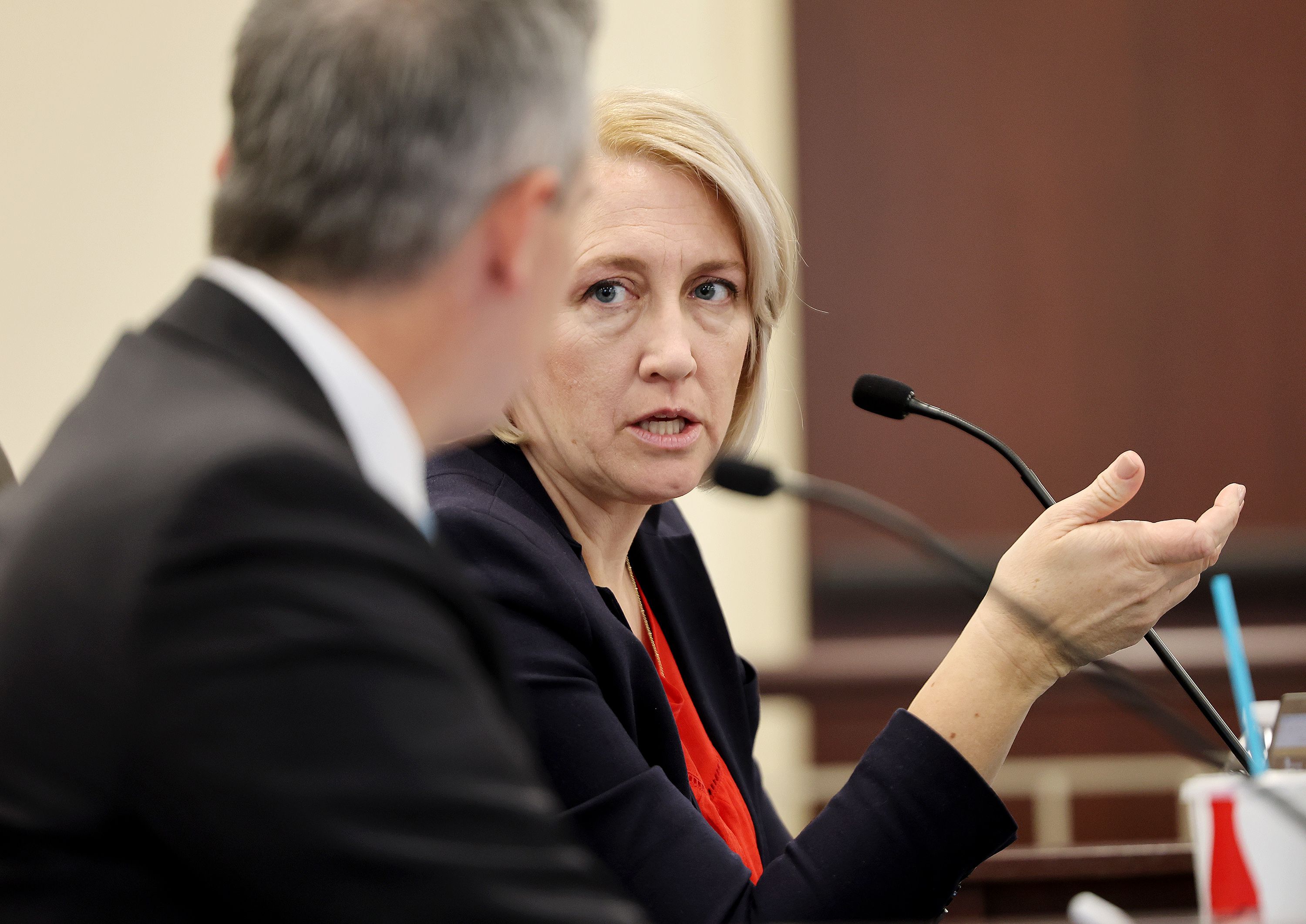 Rep. Karianne Lisonbee, R-Syracuse, sponsor of HB0467, talks with Sen. Daniel McCay, R-Riverton, in the House Judiciary committee at the Capitol on Wednesday.