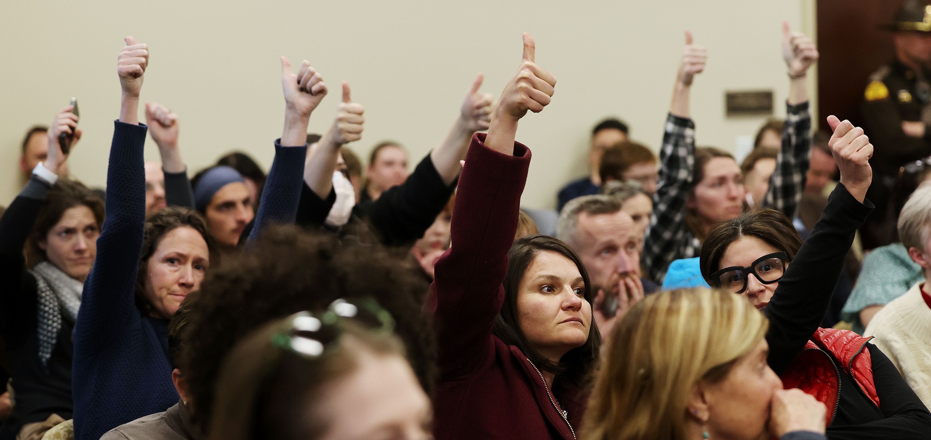 Audience members express their approval of comments in the House Judiciary committee as they hear HB0467 and HB297 at the Capitol on Wednesday.