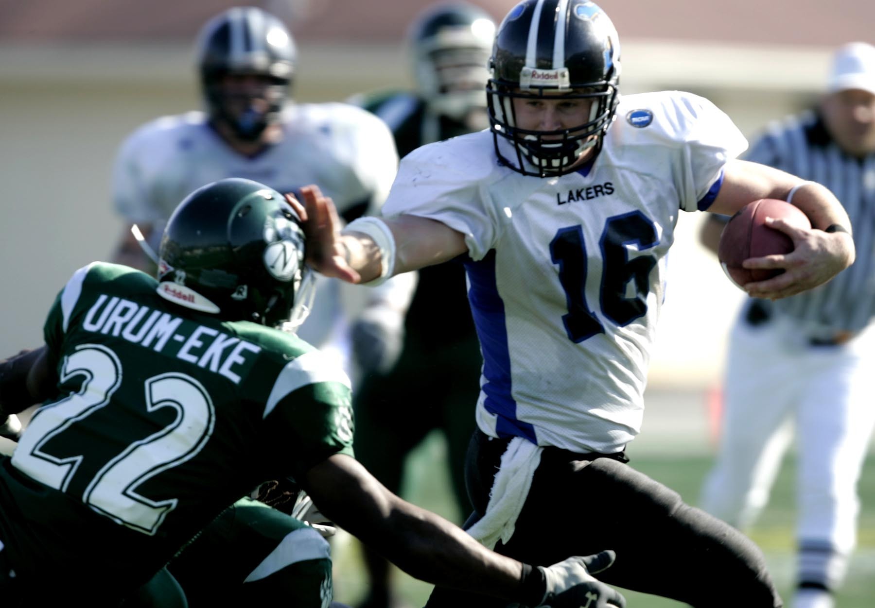 FILE - Grand Valley State quarterback Cullen Finnerty (16) holds off Northwest Missouri defender Ikechukwu Urum-Eke (22) during a Division II college football Championship game in Florence, Ala., Dec. 16, 2006. An Indiana jury has found the NCAA not liable in the death of former Grand Valley State quarterback whose widow accused the college sports governing body of failing to warn college athletes about the risks of head injuries while playing football. A Marion County jury agreed Wednesday, Feb. 15, 2023, with the NCAA’s arguments that Cullen Finnerty’s death did not result from a concussion he suffered while playing for the Michigan college or smaller blows to the head during his playing days, but from other health problems and addictions, ESPN reported. 